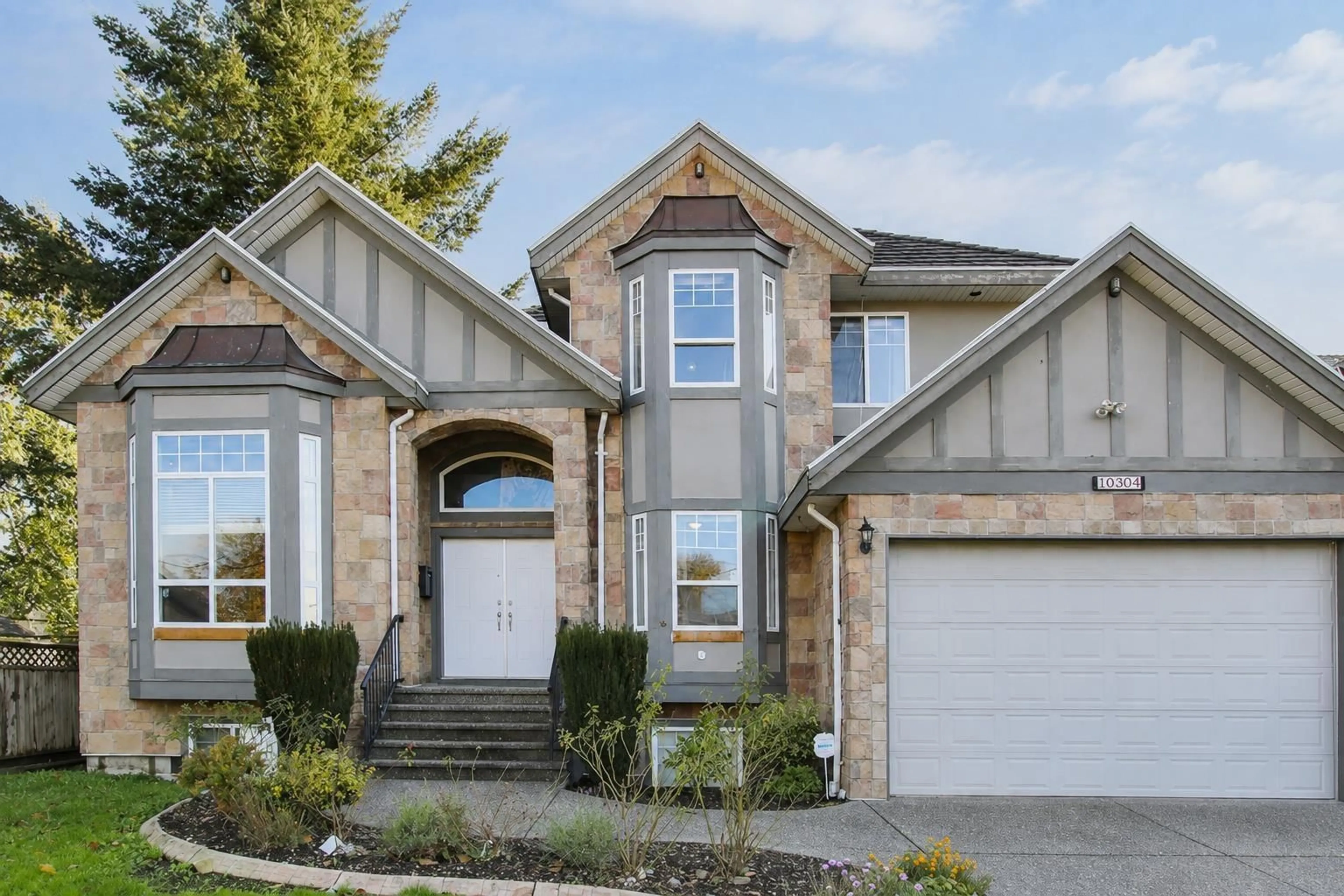 Home with brick exterior material, street for 10304 128 STREET, Surrey British Columbia V3T2Z4
