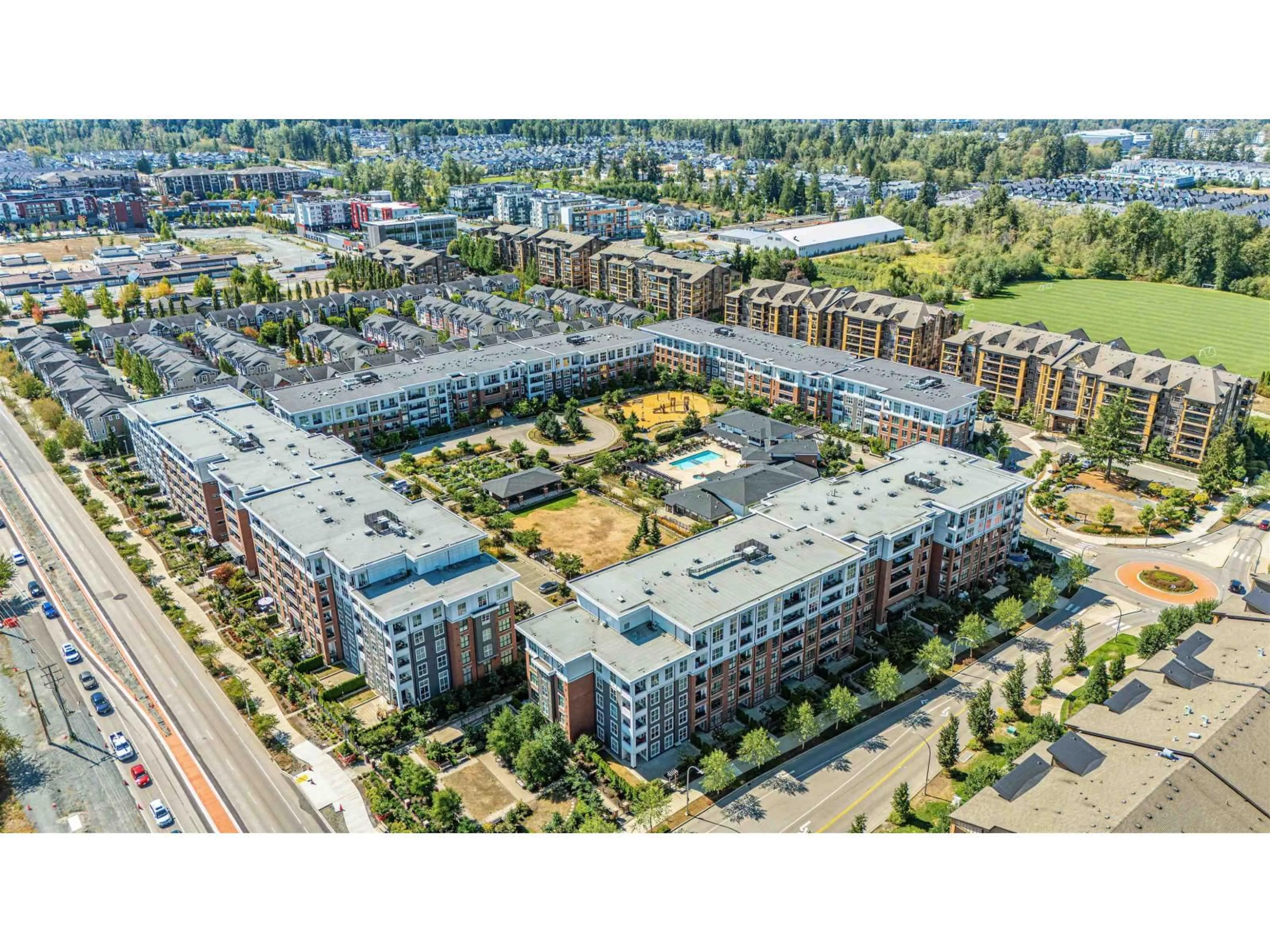 A pic from outside/outdoor area/front of a property/back of a property/a pic from drone, street for C603 - 8150 207 STREET, Langley British Columbia V2Y4J4