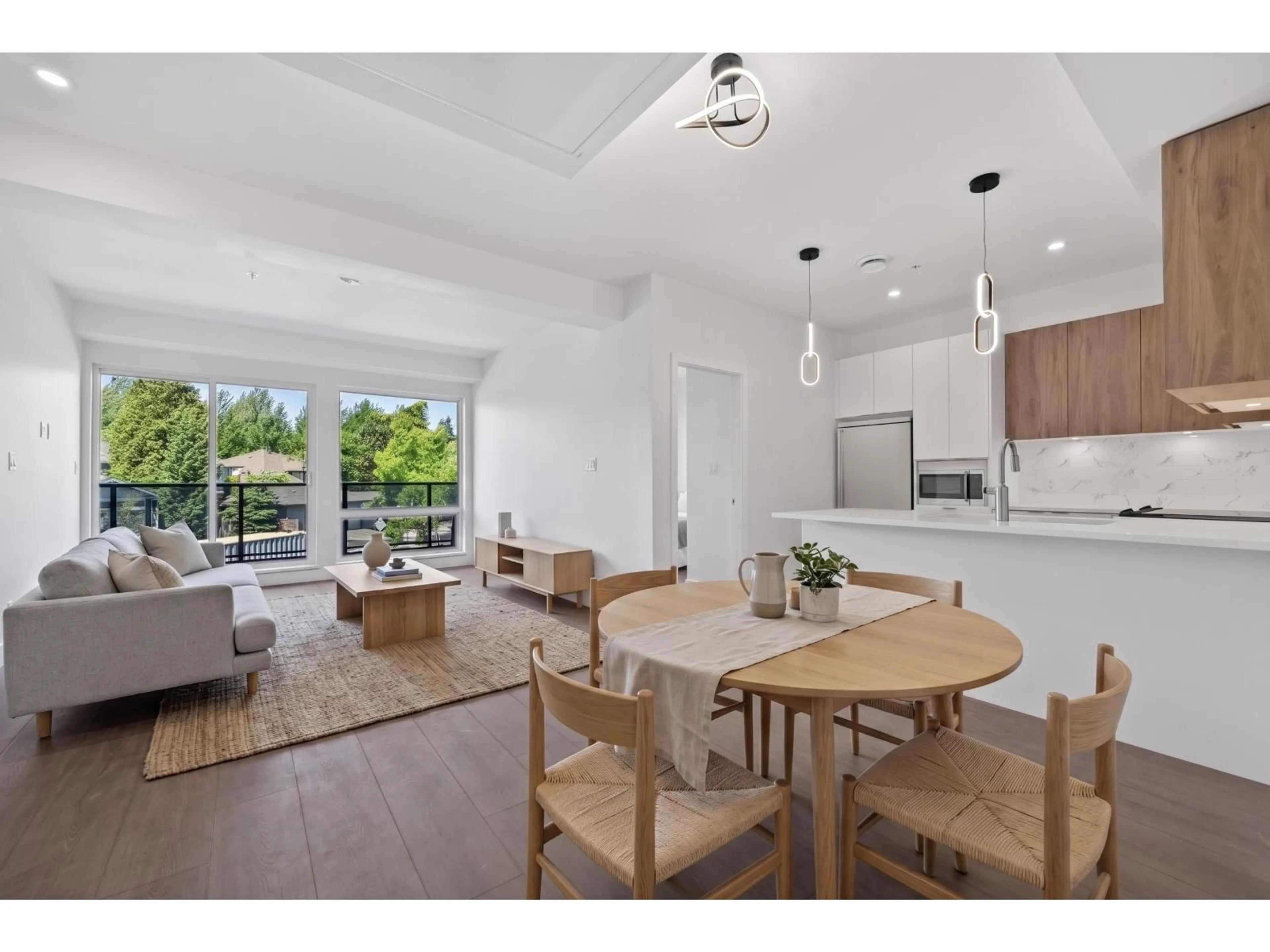 Open concept kitchen, wood/laminate floor for 408 - 2233 156 STREET, Surrey British Columbia V4A4V3
