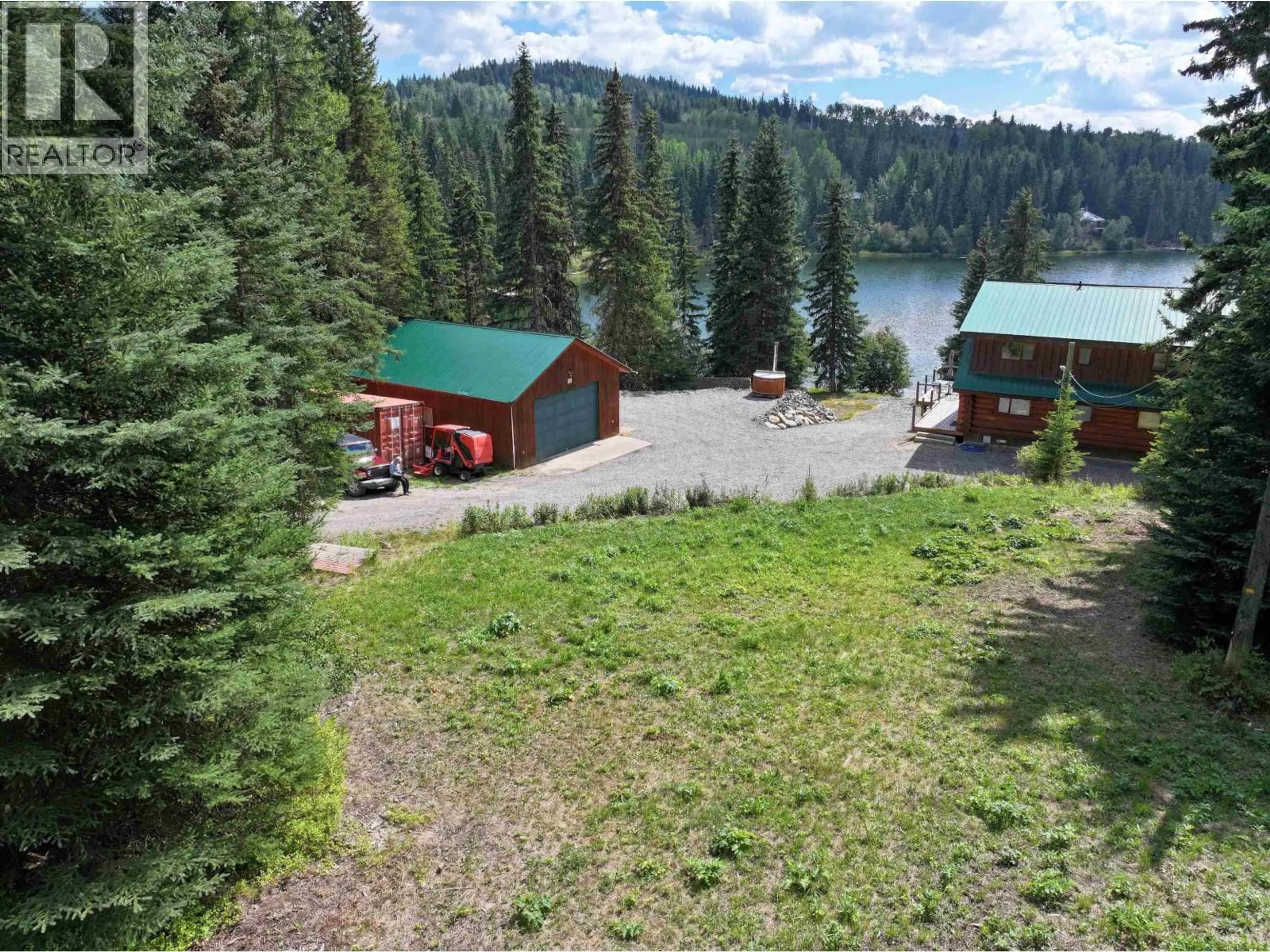 A pic from outside/outdoor area/front of a property/back of a property/a pic from drone, water/lake/river/ocean view for 8246 CENTENNIAL ROAD, Bridge Lake British Columbia V0K1X2