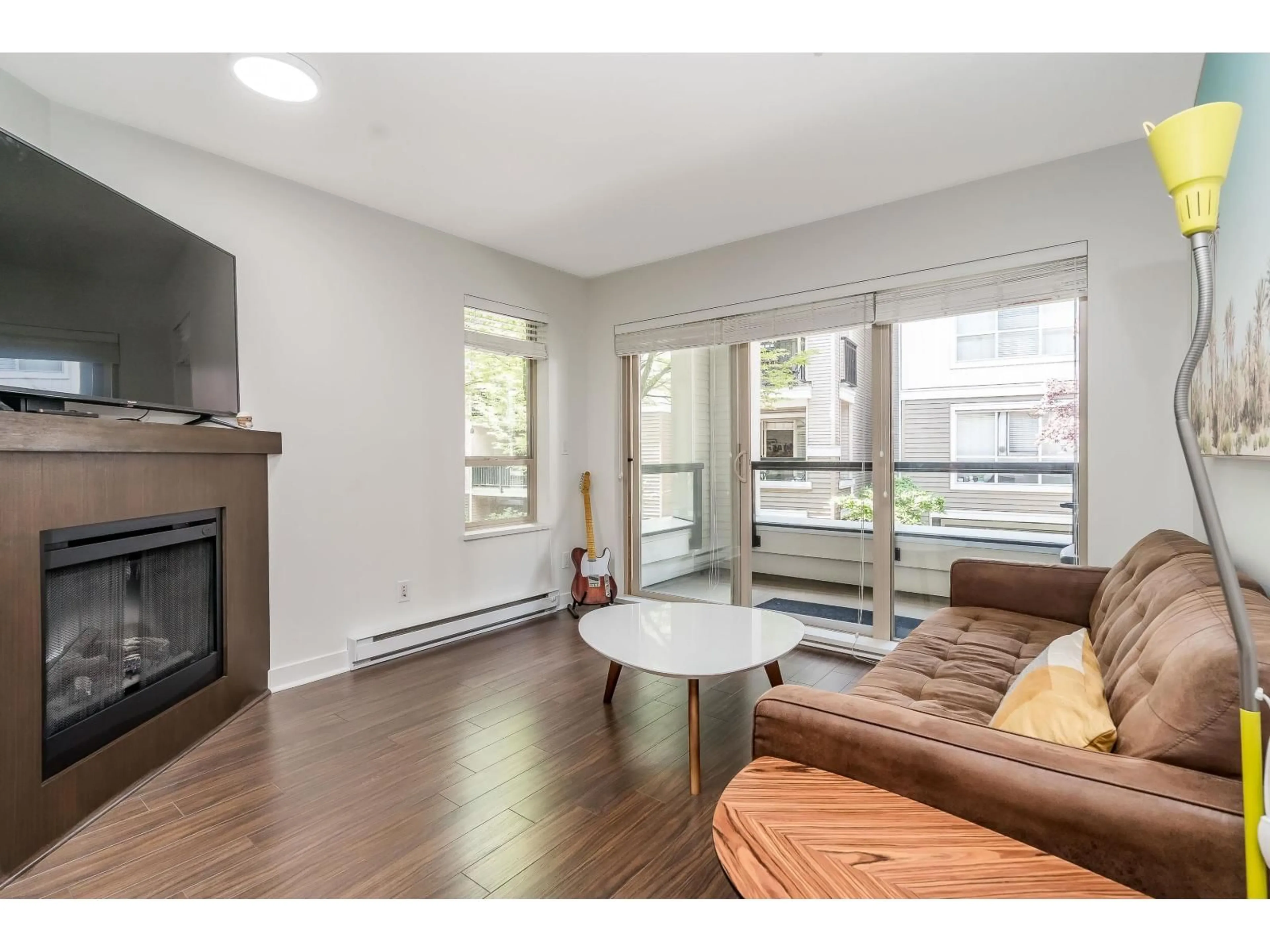 Living room with furniture, wood/laminate floor for A218 - 8929 202 STREET, Langley British Columbia V1M0B4