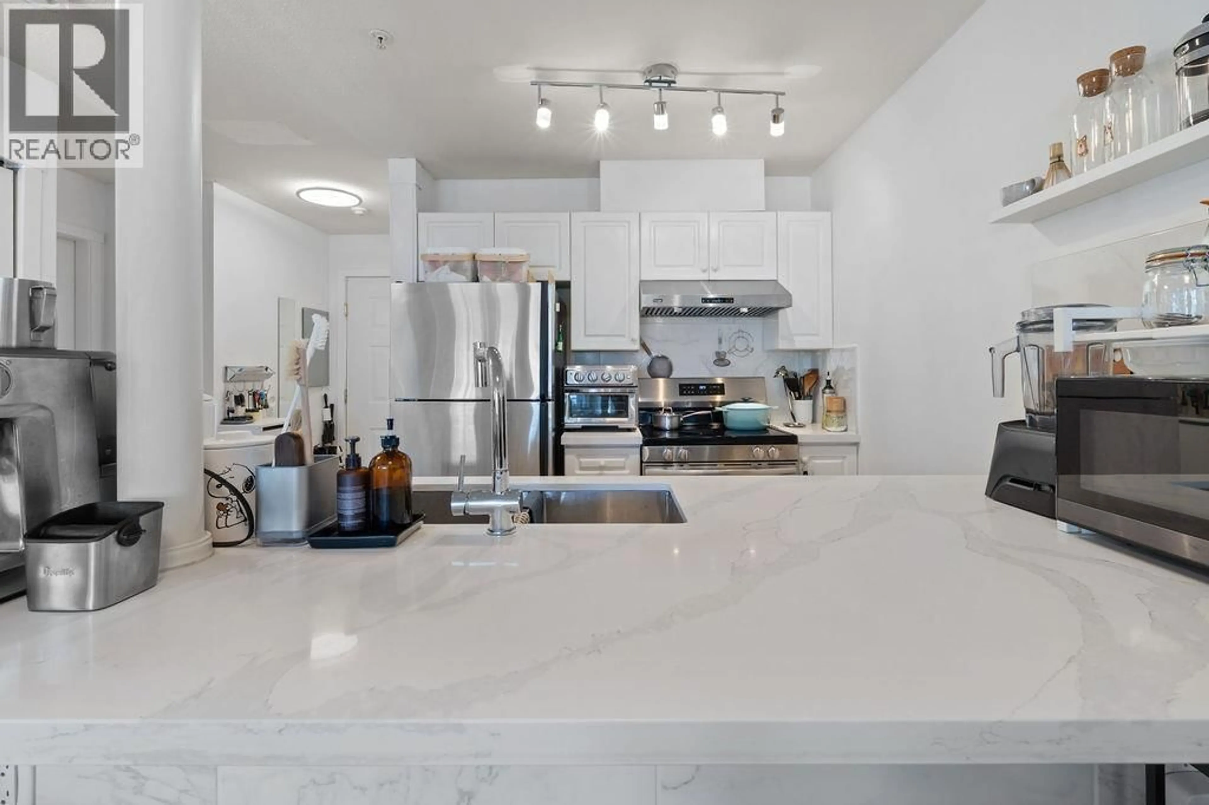 Open concept kitchen, ceramic/tile floor for 211 - 3628 RAE AVENUE, Vancouver British Columbia V5R2P5