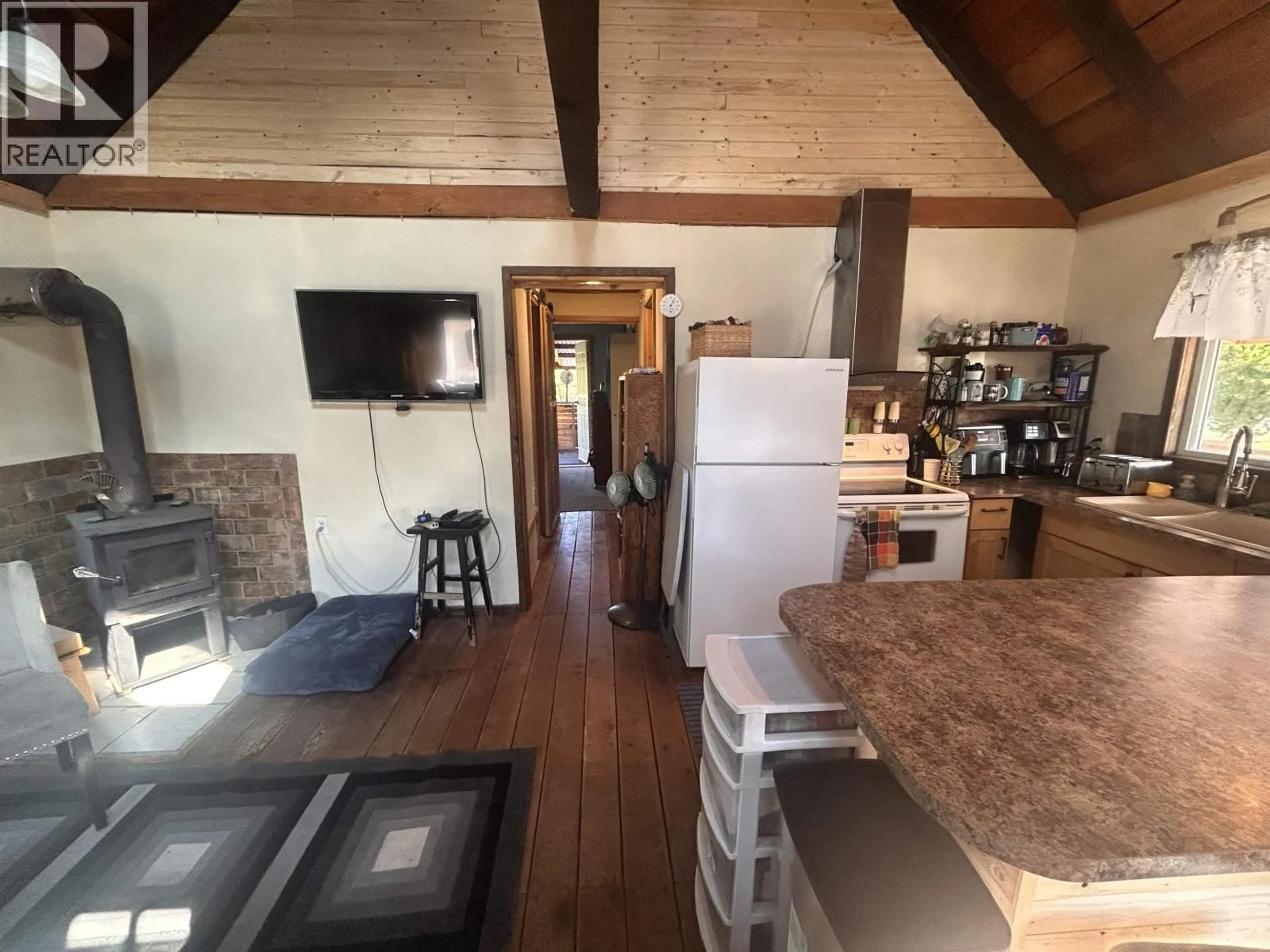 Open concept kitchen, wood/laminate floor for 1889 PUNTZI AIRPORT ROAD, Chilcotin British Columbia V0L1H0