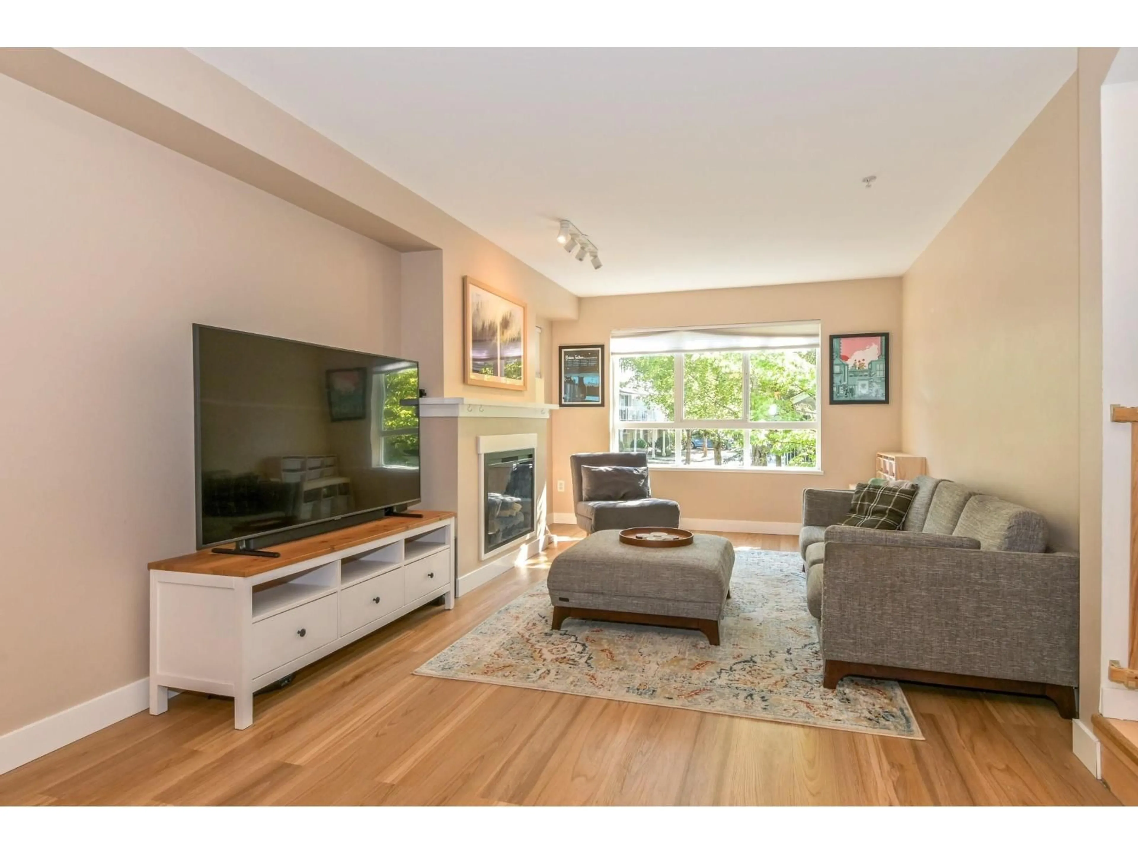 Living room with furniture, wood/laminate floor for 143 - 6747 203 STREET, Langley British Columbia V2Y3B5