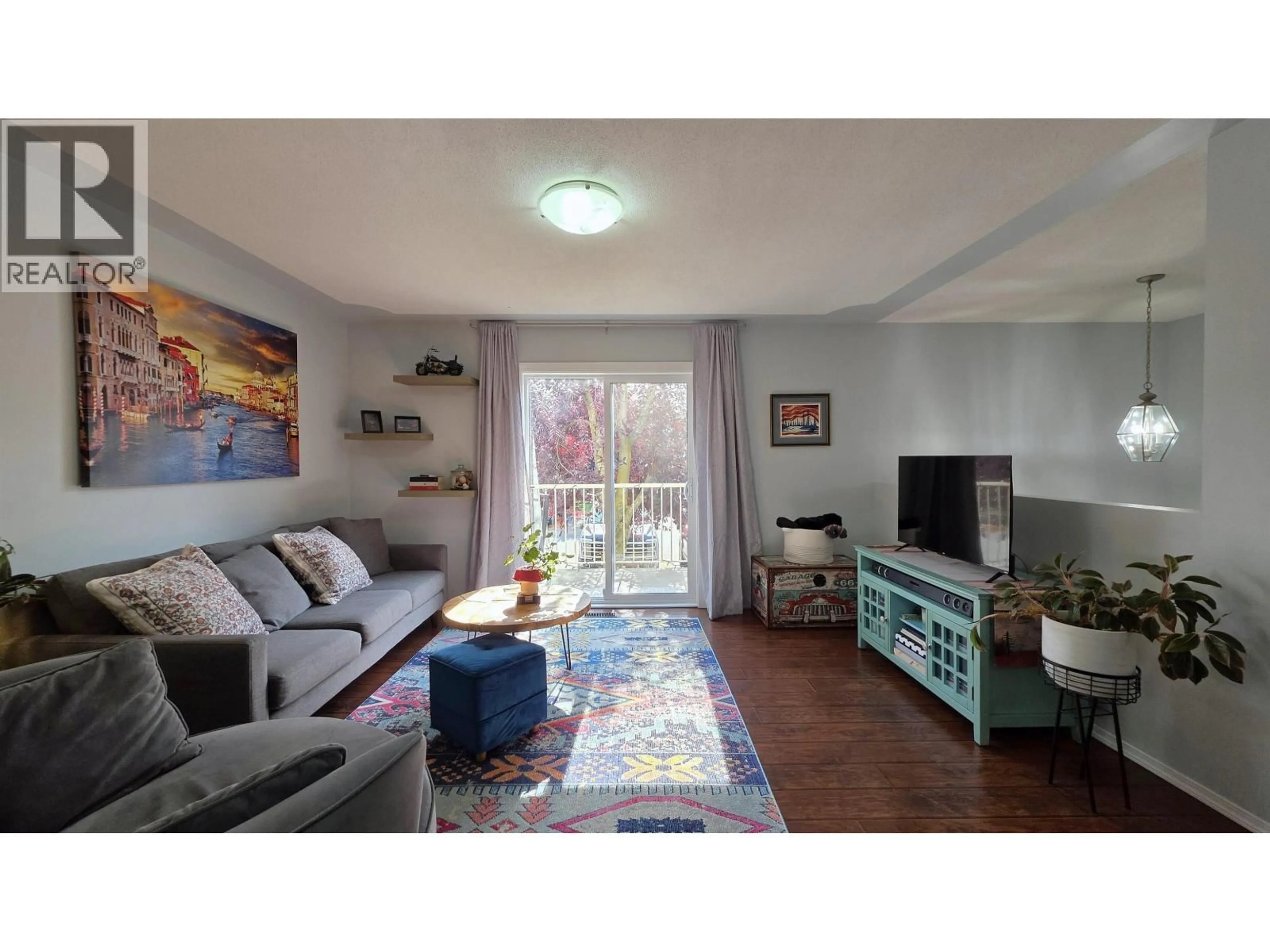 Living room with furniture, wood/laminate floor for 110 - 4025 22ND AVENUE, Prince George British Columbia V2N4Y9