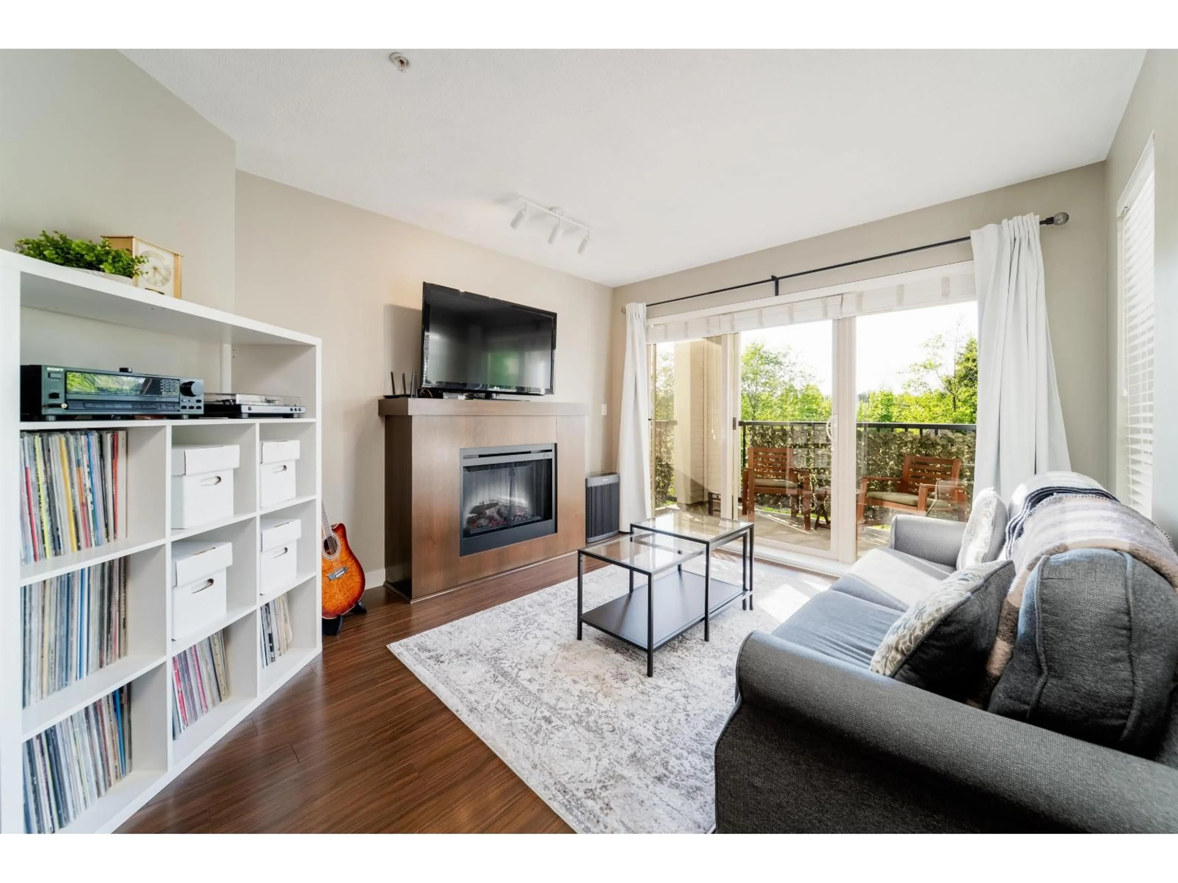 Living room with furniture, wood/laminate floor for D207 - 8929 202 STREET, Langley British Columbia V1M0B4