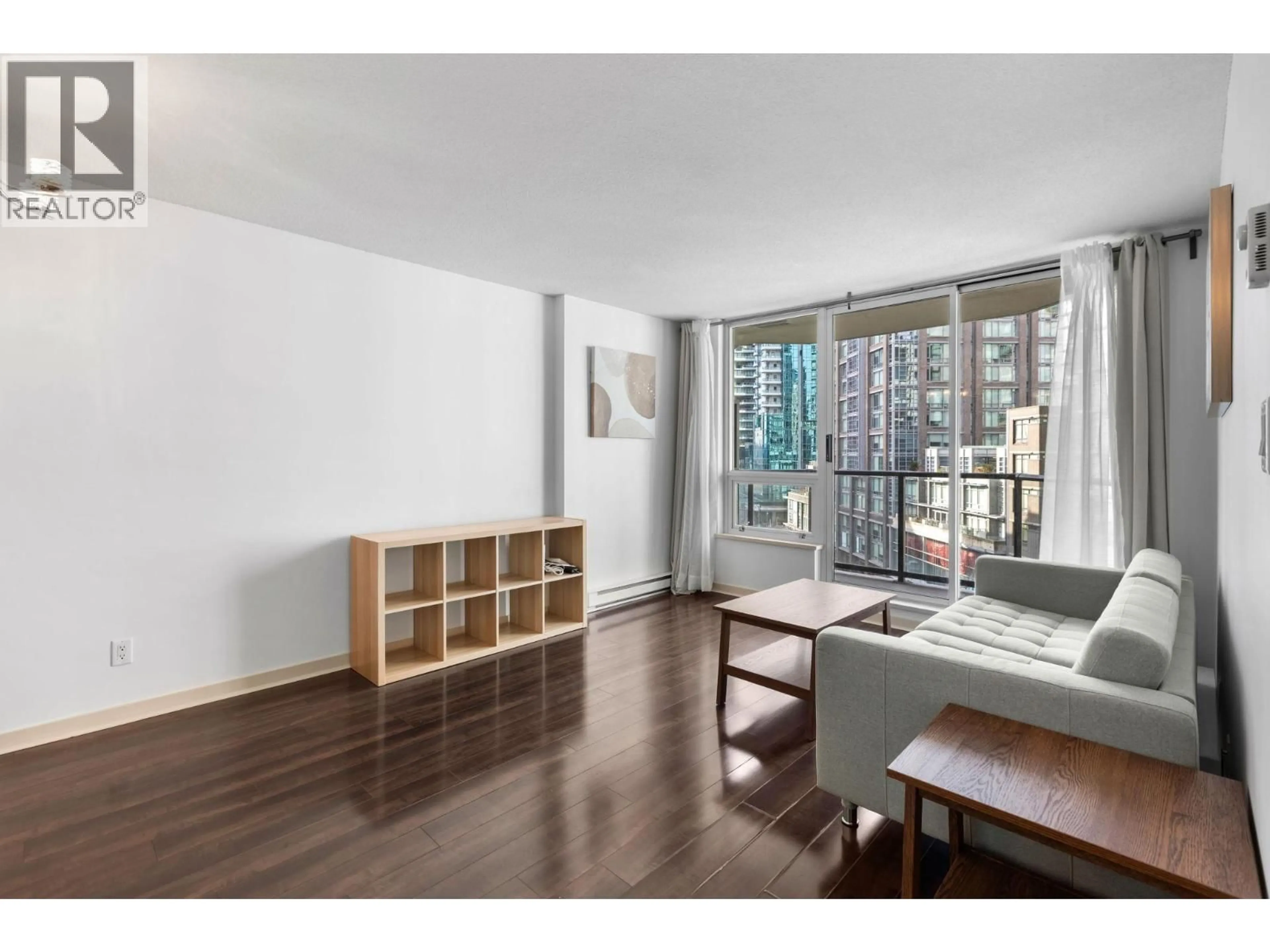 Living room with furniture, wood/laminate floor for 706 - 1212 HOWE STREET, Vancouver British Columbia V6Z2M9