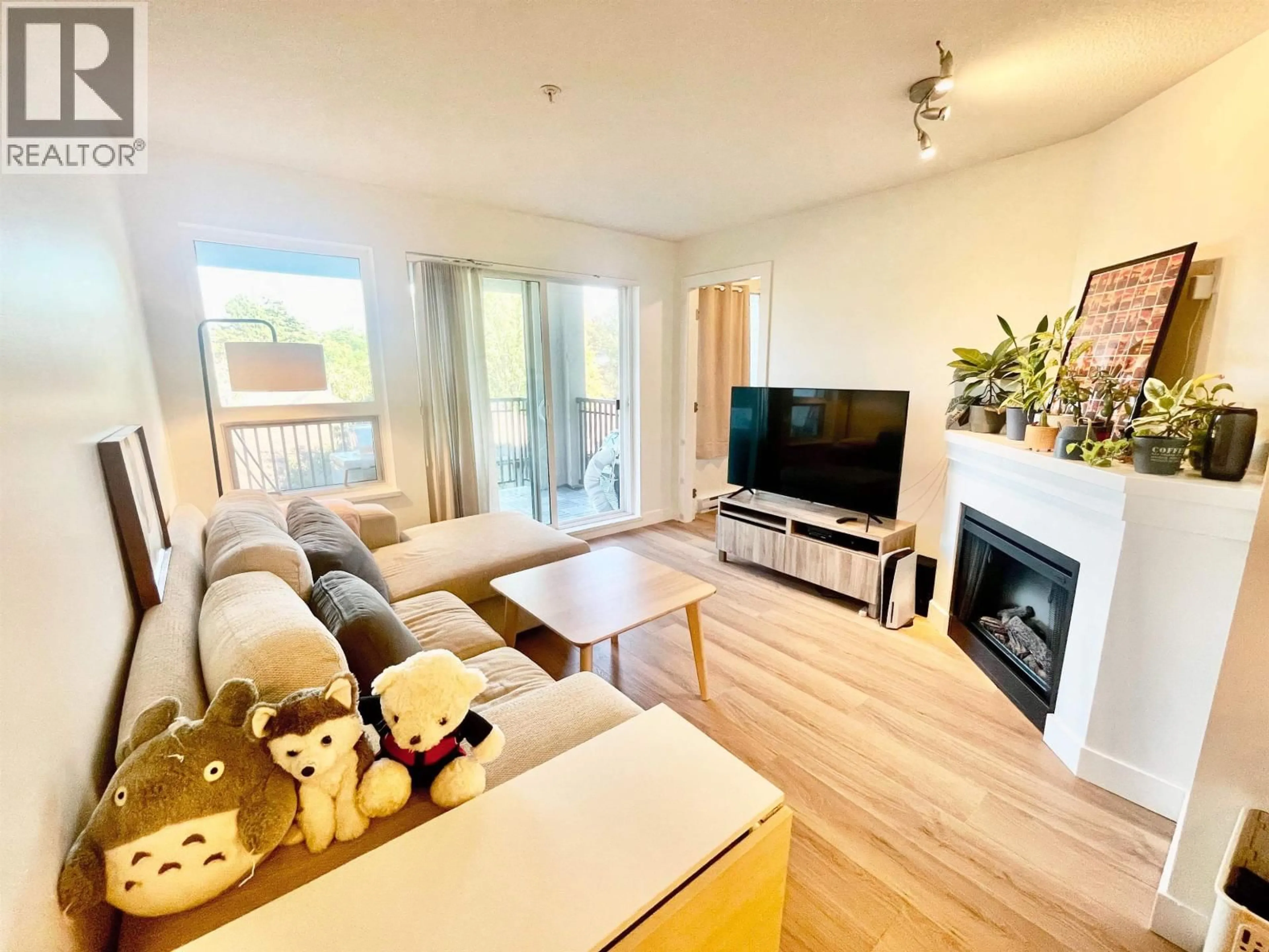Living room with furniture, wood/laminate floor for 301 - 8600 PARK ROAD, Richmond British Columbia V6Y0C3