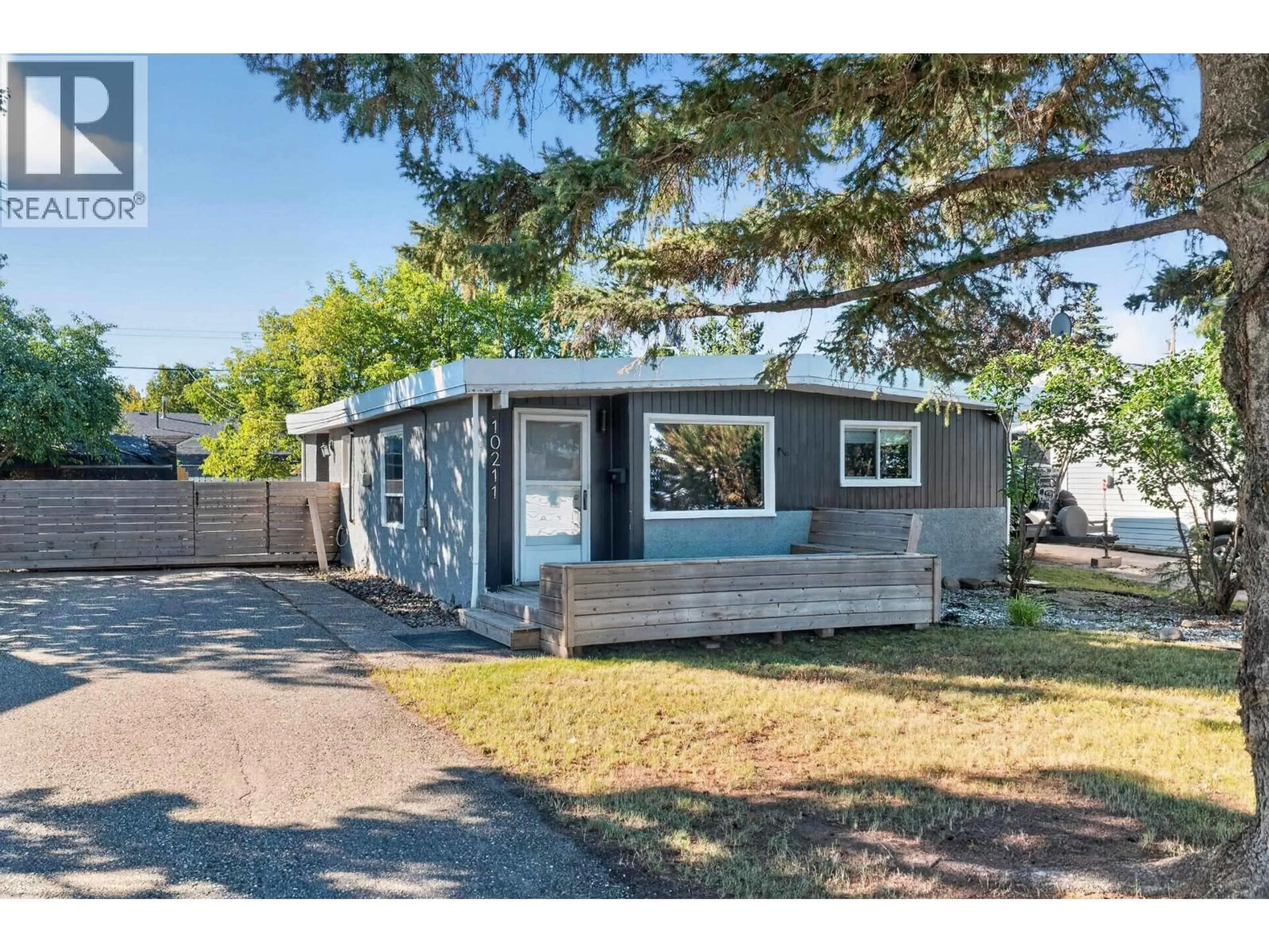 Home with vinyl exterior material, street for 10211 110 AVENUE, Fort St. John British Columbia V1J2T3