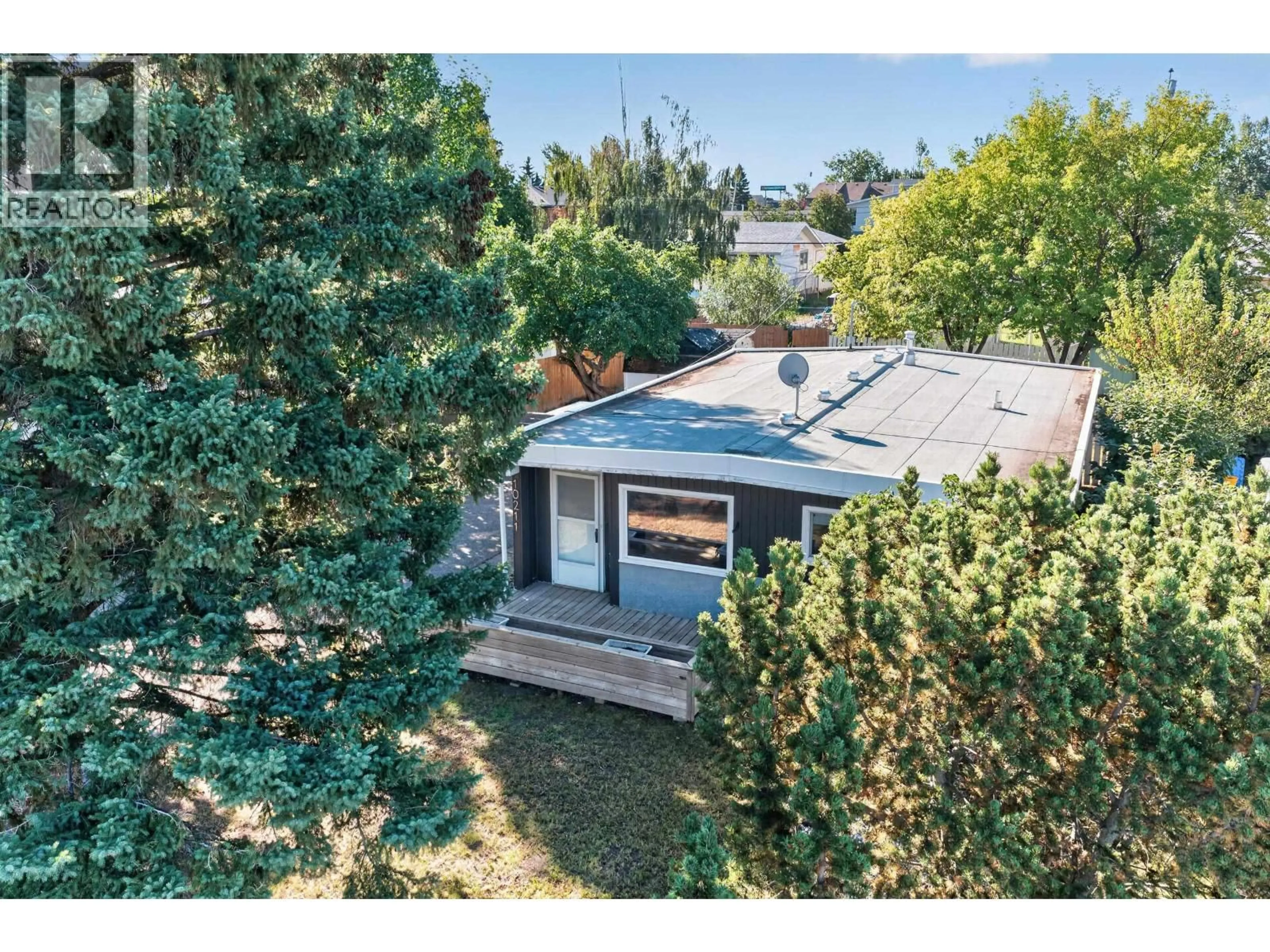 A pic from outside/outdoor area/front of a property/back of a property/a pic from drone, street for 10211 110 AVENUE, Fort St. John British Columbia V1J2T3