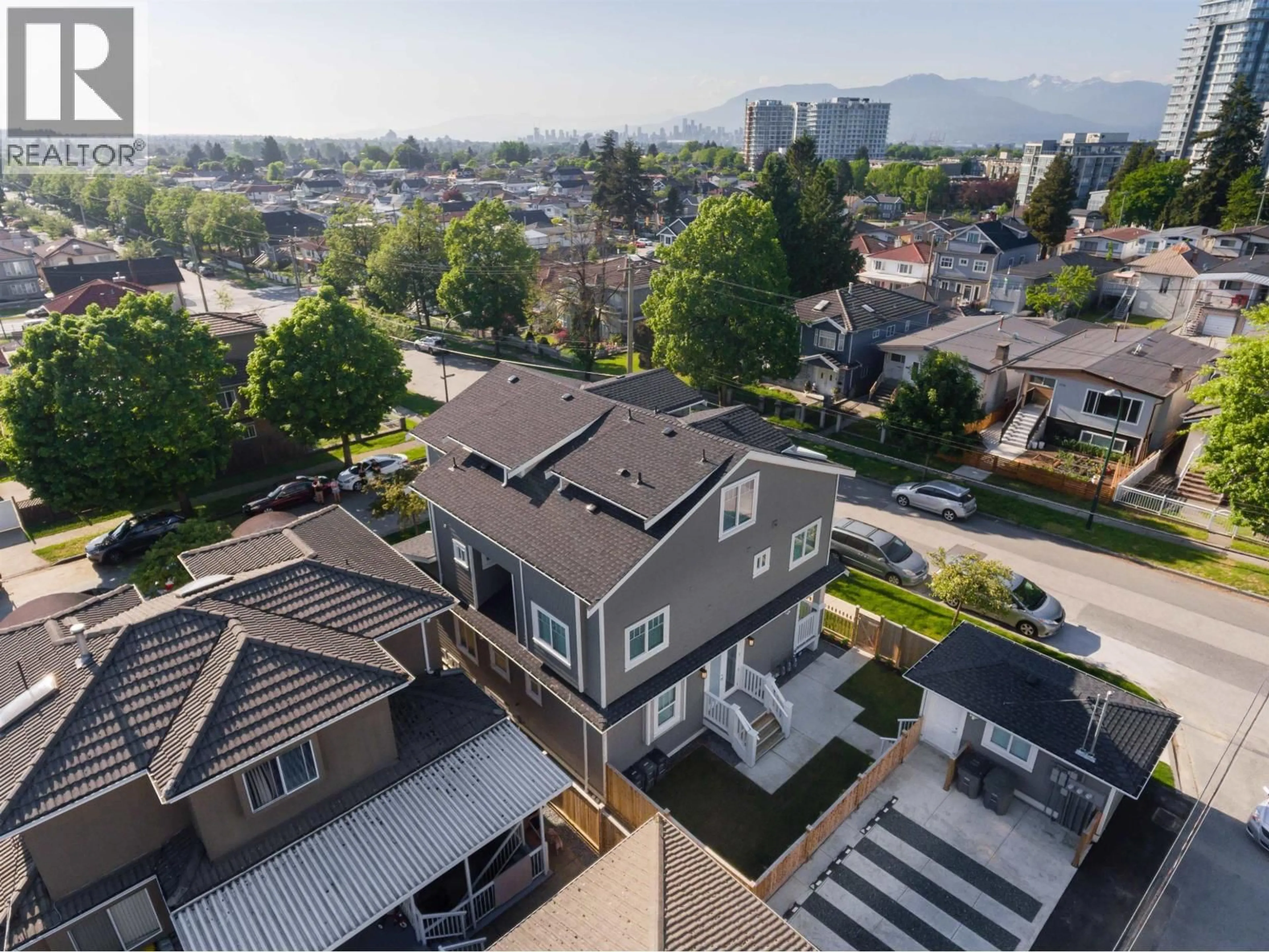 A pic from outside/outdoor area/front of a property/back of a property/a pic from drone, mountain view for 2368 34TH AVENUE, Vancouver British Columbia V5R2S6