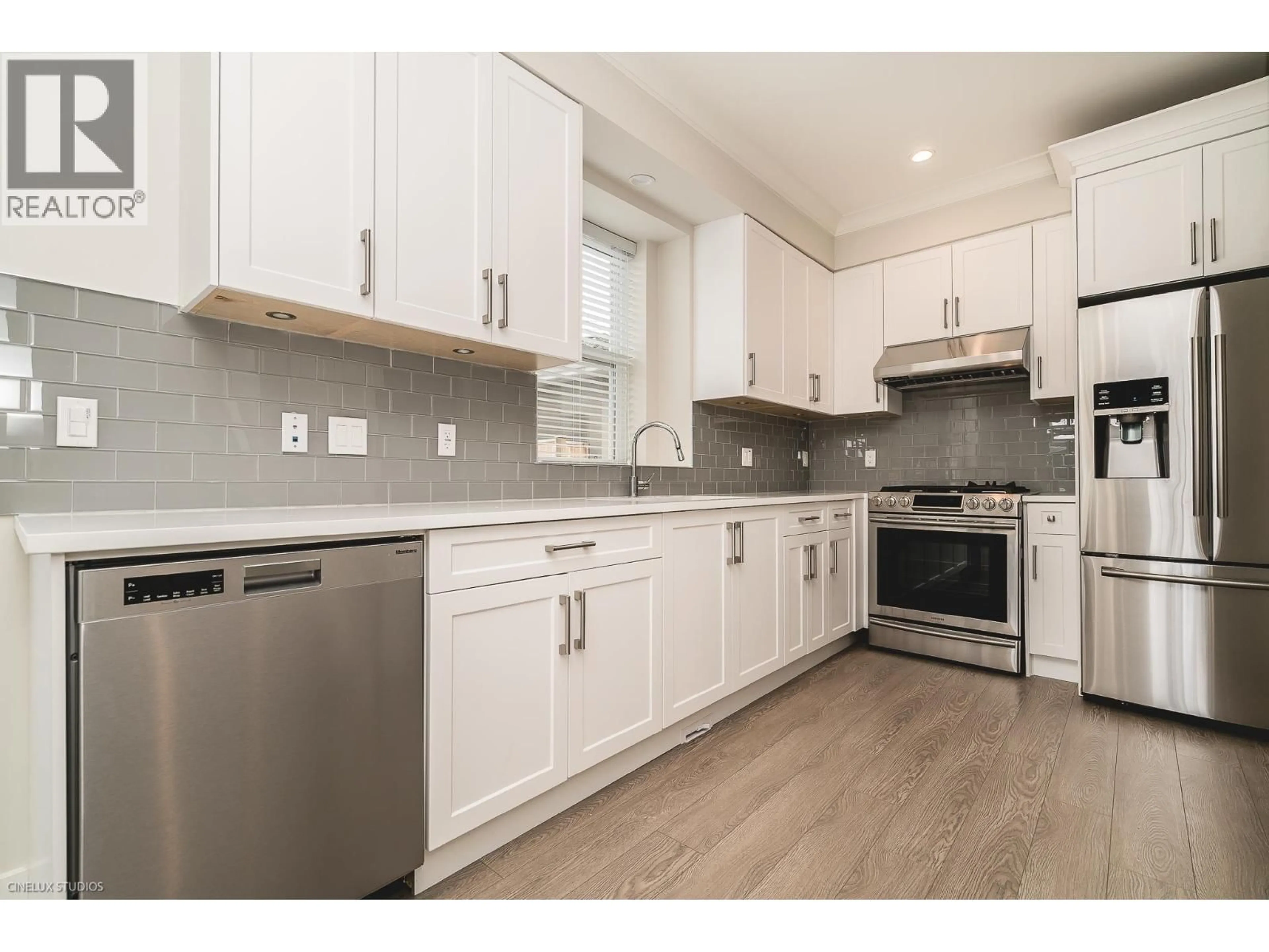 Open concept kitchen, wood/laminate floor for 2368 34TH AVENUE, Vancouver British Columbia V5R2S6