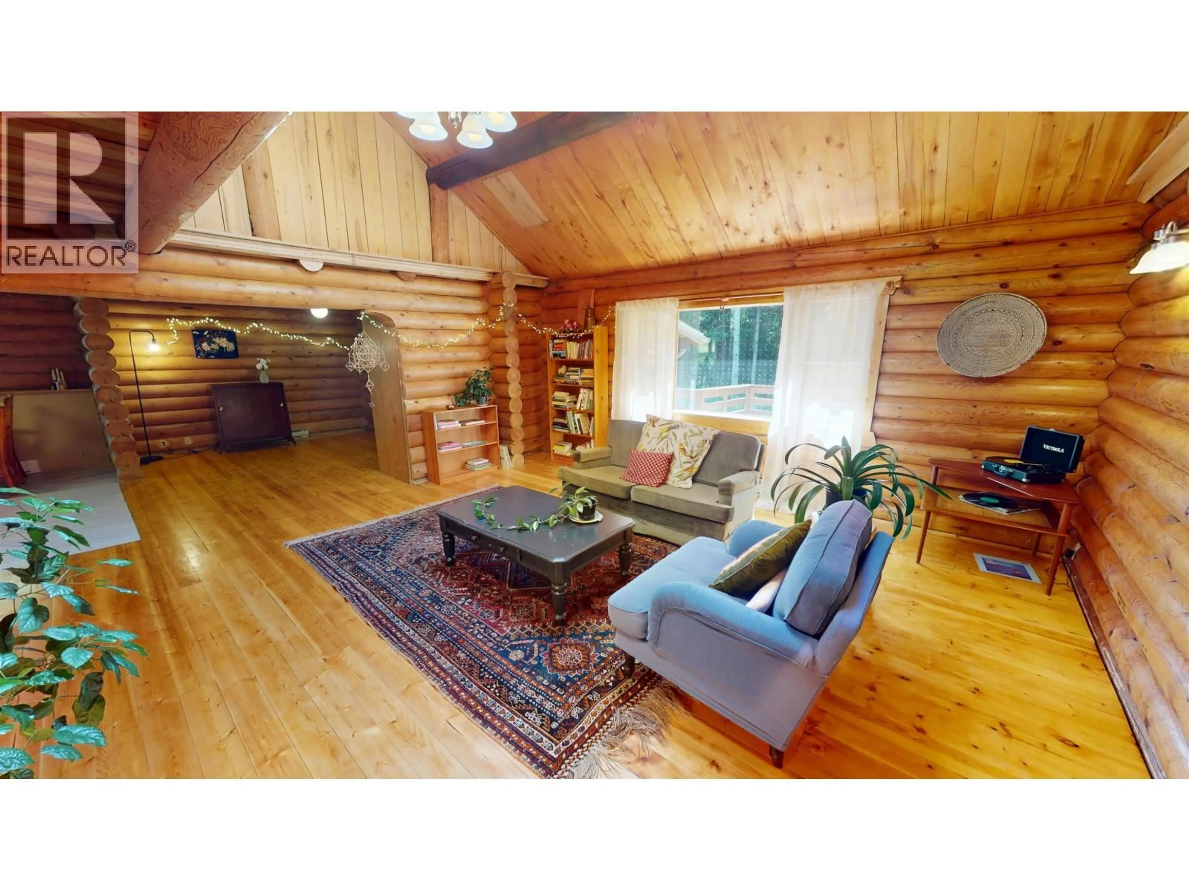 Living room with furniture, wood/laminate floor for 5092 QUESNEL-HIXON ROAD, Quesnel British Columbia V2J6Y7