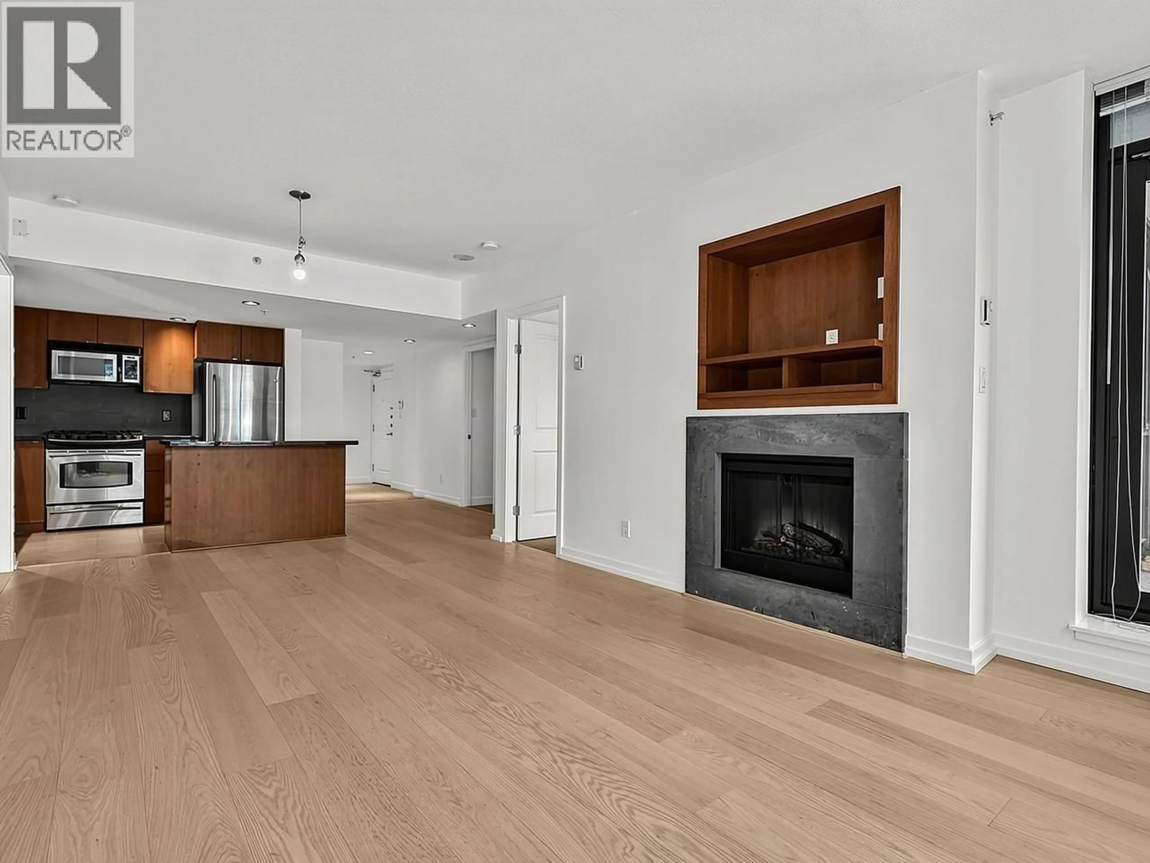 Open concept kitchen, wood/laminate floor for 203 - 9188 HEMLOCK DRIVE, Richmond British Columbia V6Y4J7
