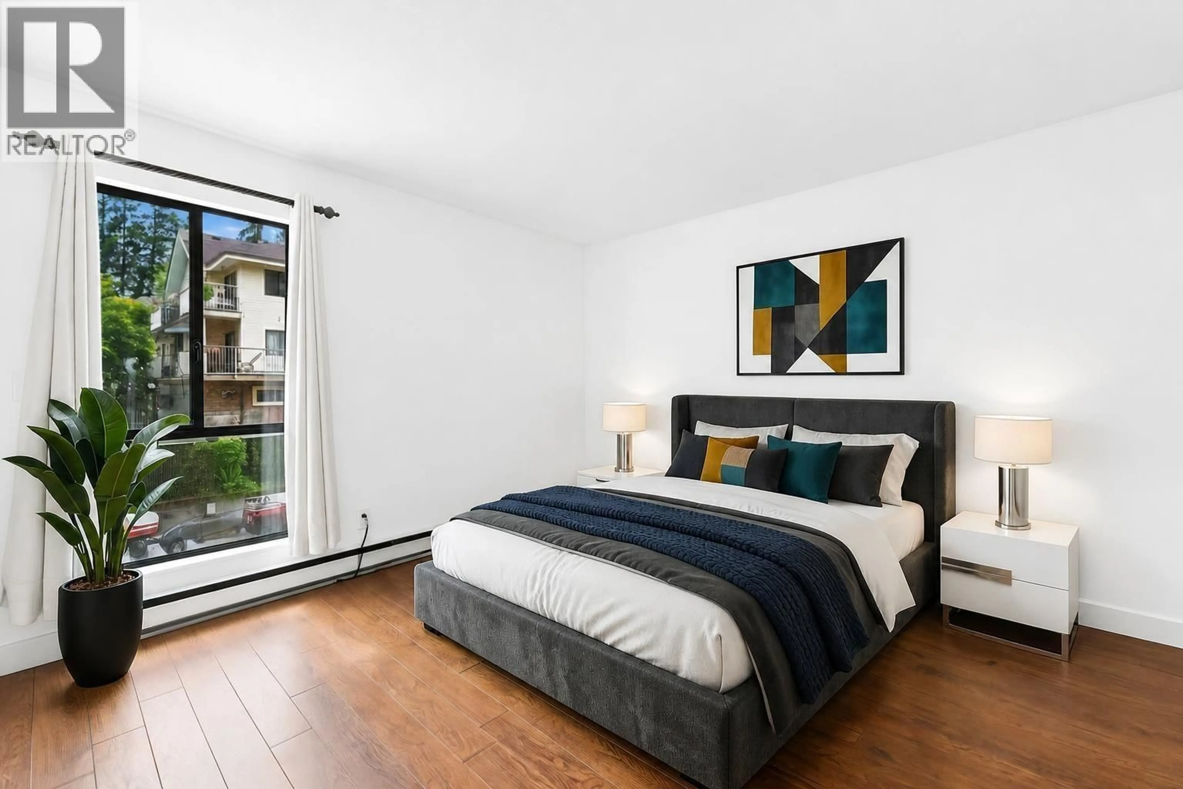 Bedroom with bed, wood/laminate floor for 104 - 2181 PANORAMA DRIVE, North Vancouver British Columbia V7G1V3
