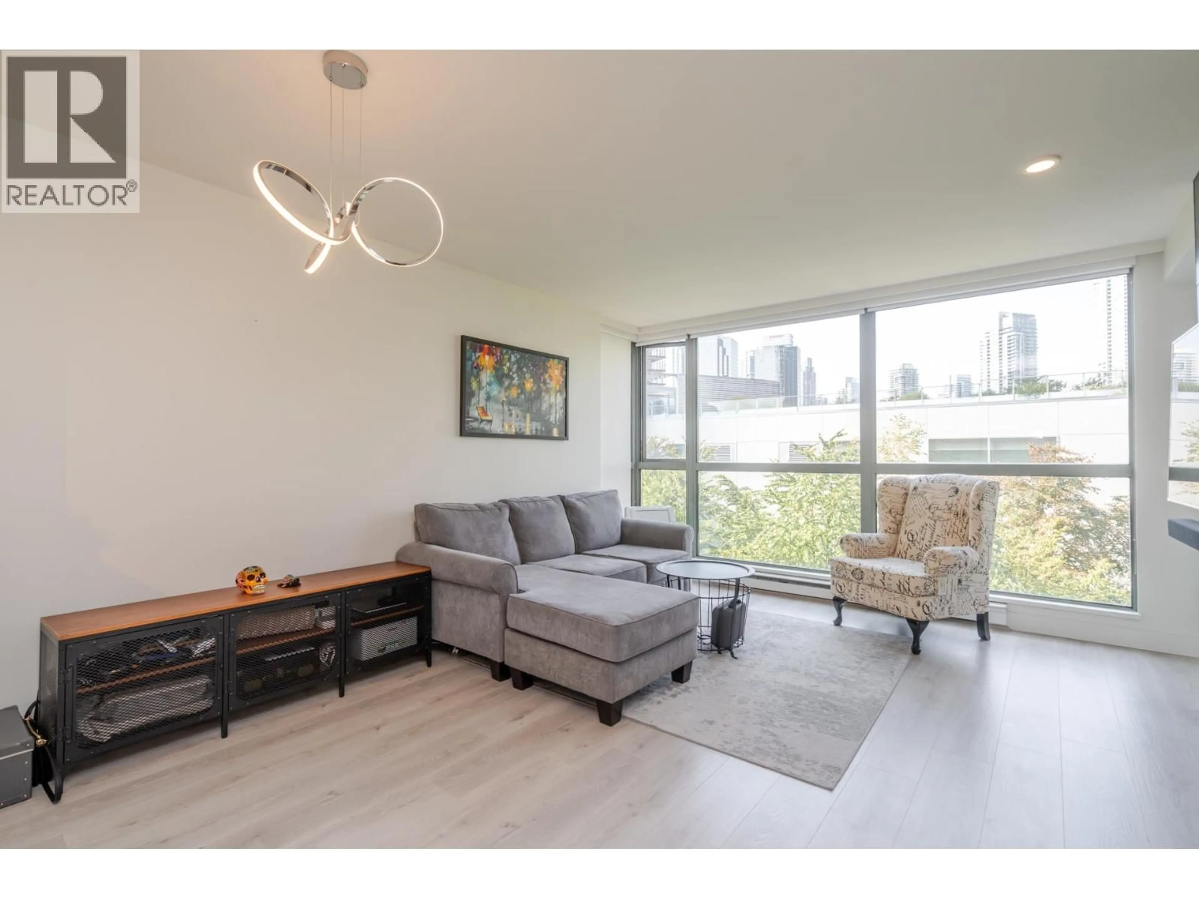 Living room with furniture, wood/laminate floor for 602 - 4888 HAZEL STREET, Burnaby British Columbia V5H4T4