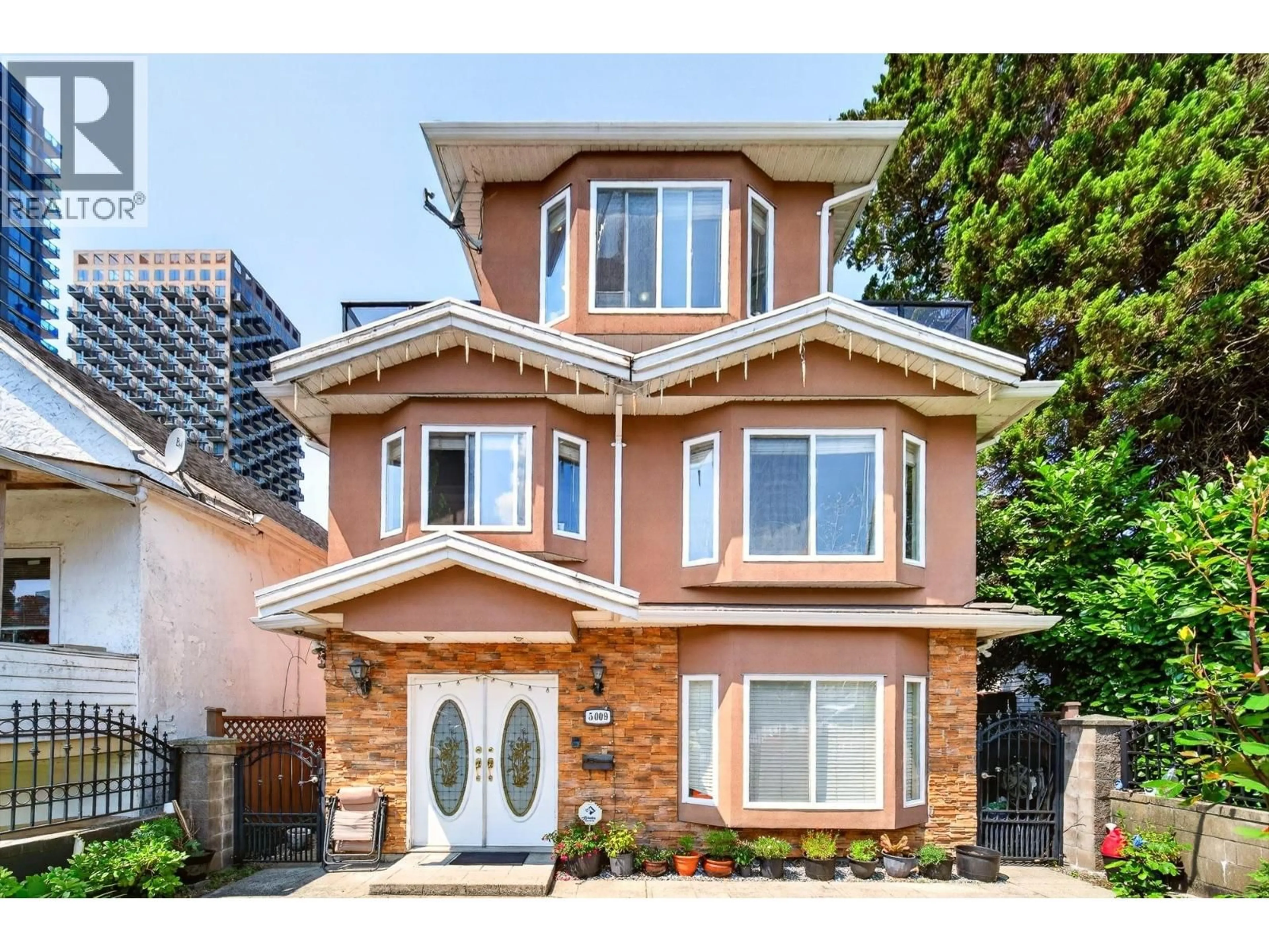 Home with brick exterior material, street for 5009 PAYNE STREET, Vancouver British Columbia V5R4J5