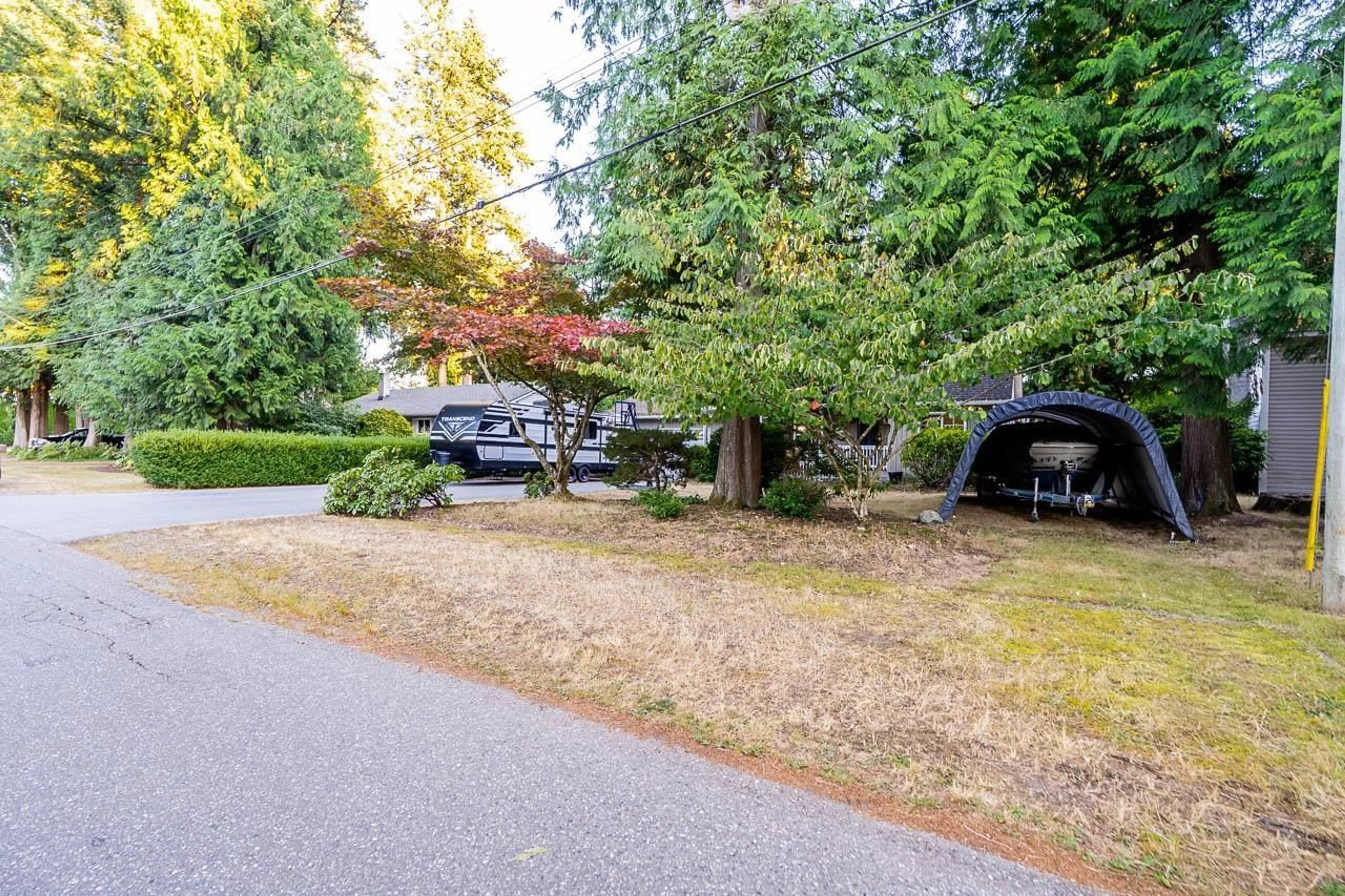A pic from outside/outdoor area/front of a property/back of a property/a pic from drone, forest/trees view for 19860 35 AVENUE, Langley British Columbia V3A2P6