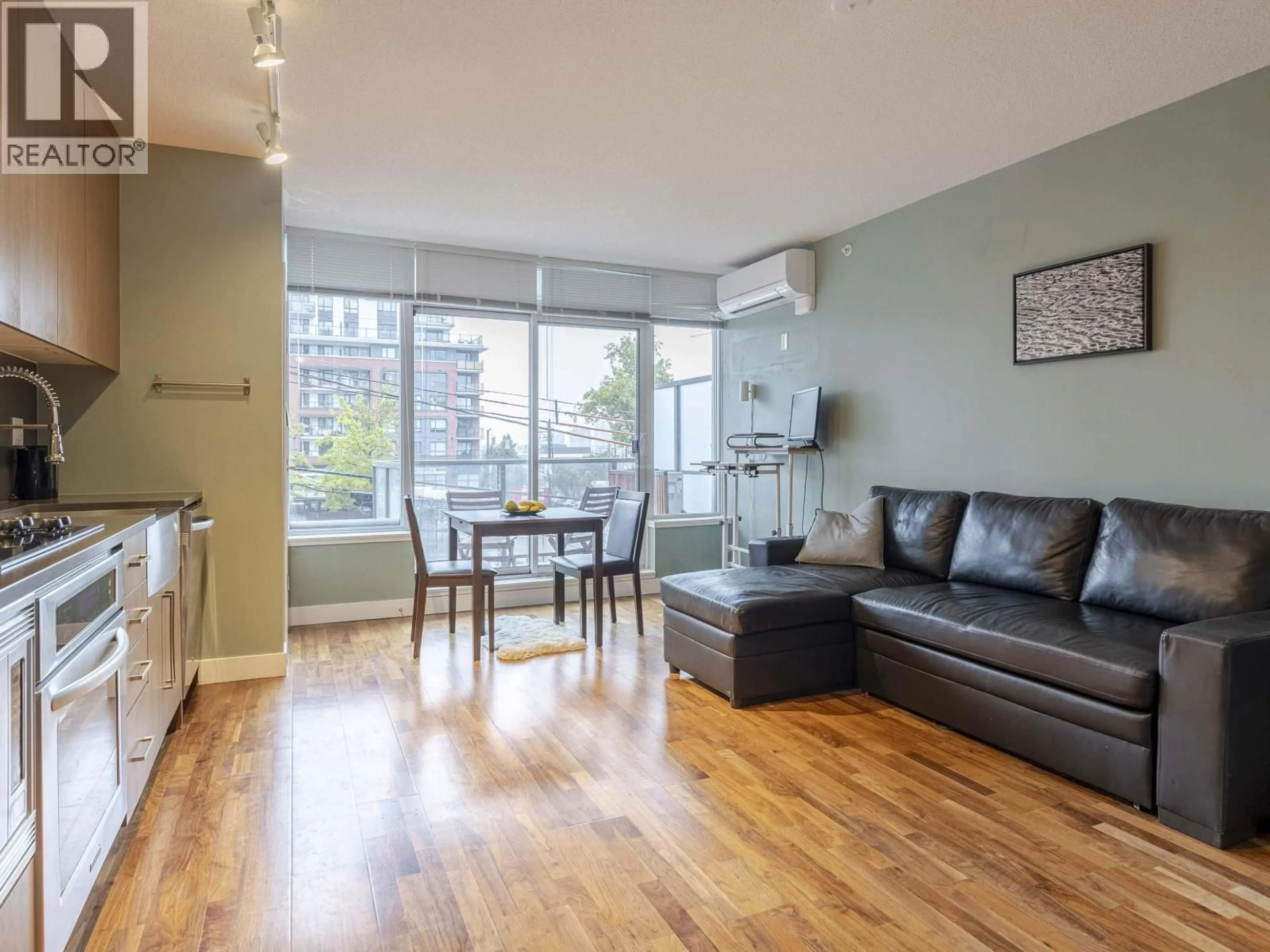 Living room with furniture, wood/laminate floor for 473 - 250 E 6TH AVENUE, Vancouver British Columbia V5T0B7