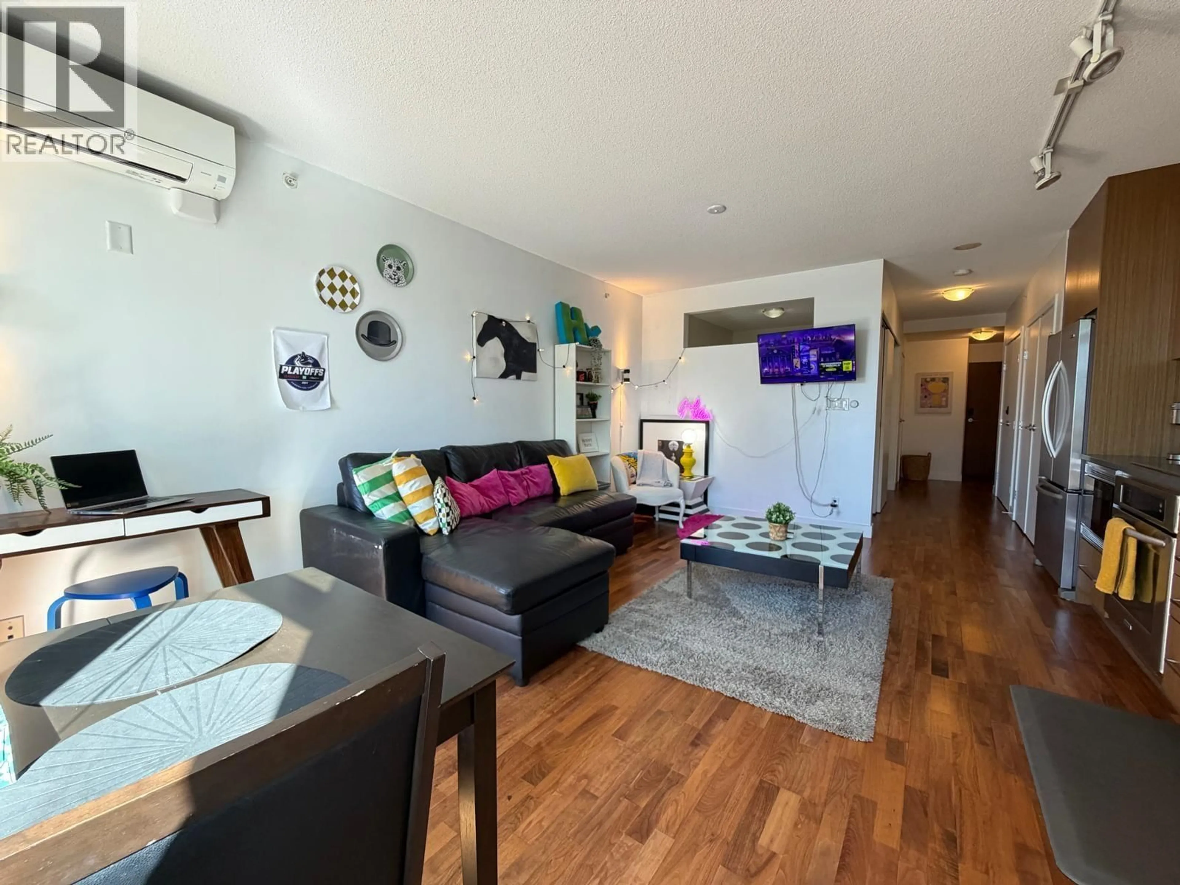 Living room with furniture, wood/laminate floor for 473 - 250 E 6TH AVENUE, Vancouver British Columbia V5T0B7