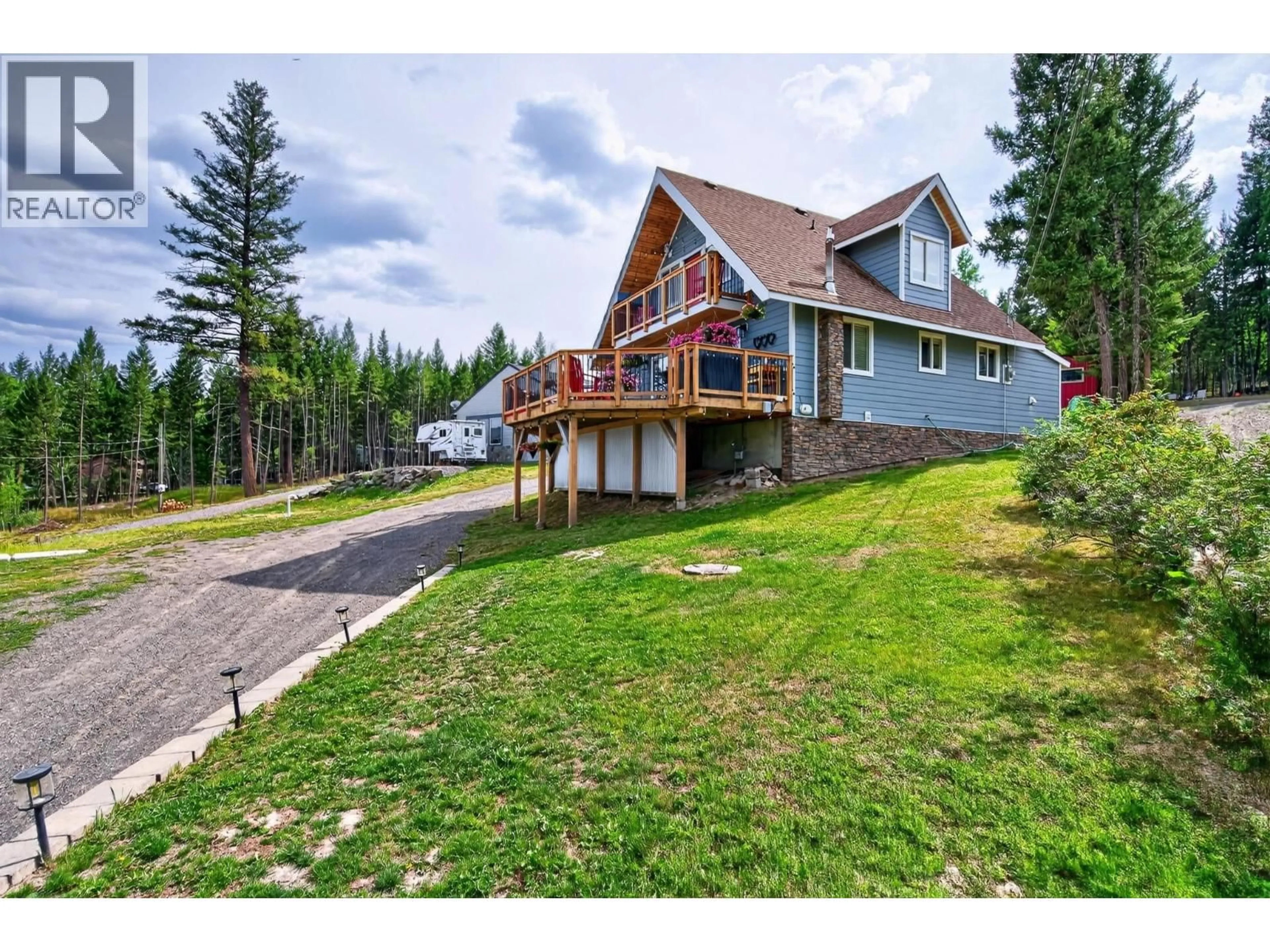 A pic from outside/outdoor area/front of a property/back of a property/a pic from drone, mountain view for 6294 MULLIGAN DRIVE, Horse Lake British Columbia V0K2E3