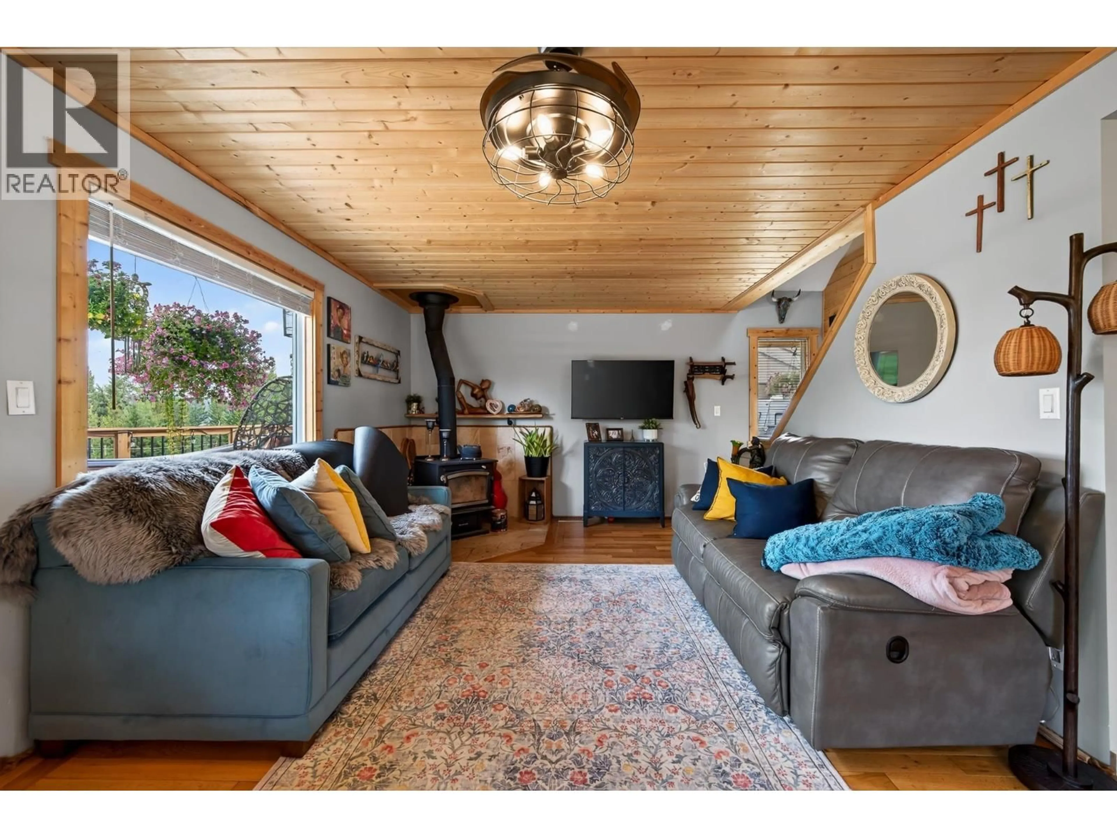 Living room with furniture, wood/laminate floor for 6294 MULLIGAN DRIVE, Horse Lake British Columbia V0K2E3