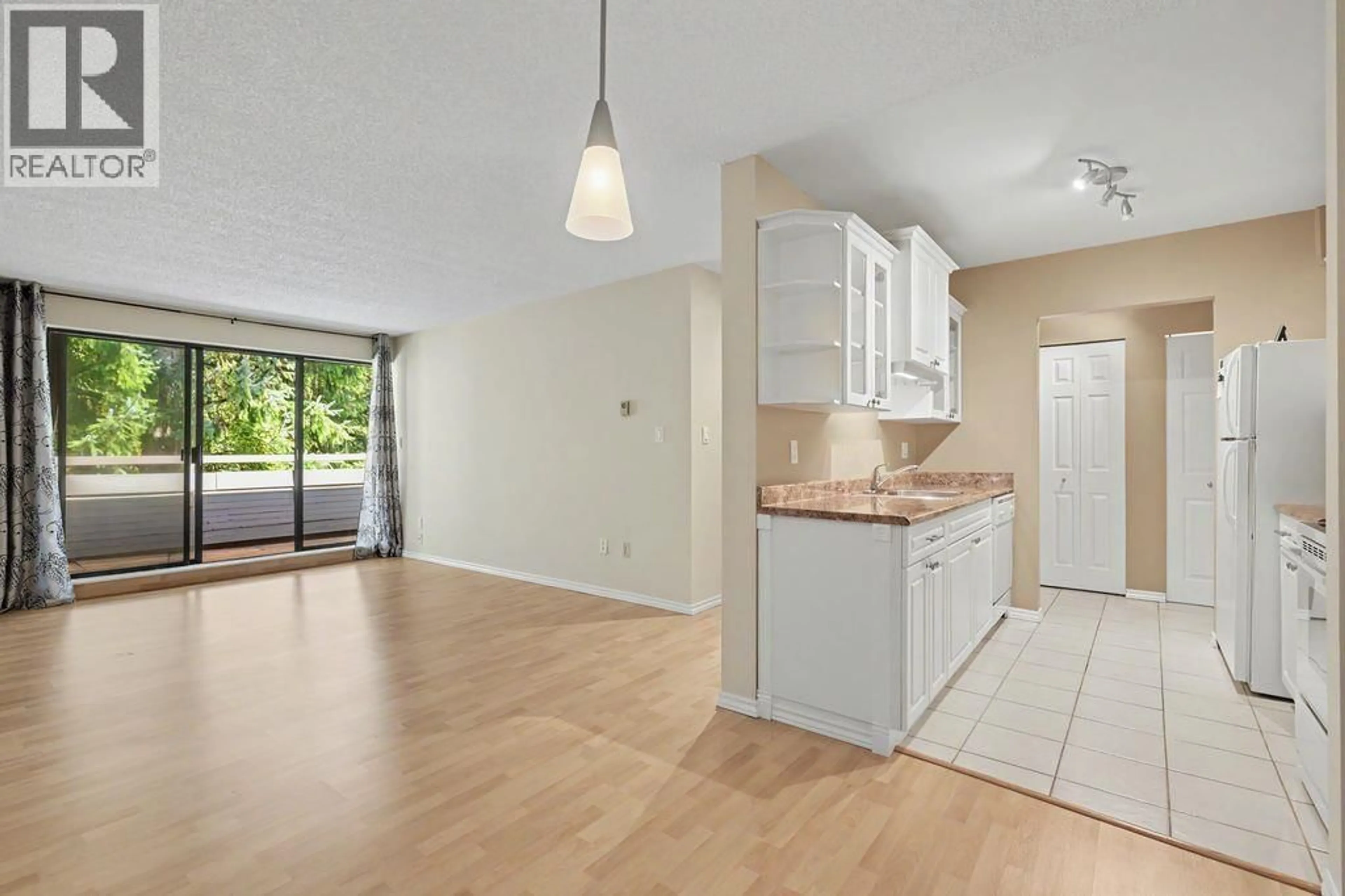 Open concept kitchen, wood/laminate floor for 404 - 1210 PACIFIC STREET, Coquitlam British Columbia V3B6K3