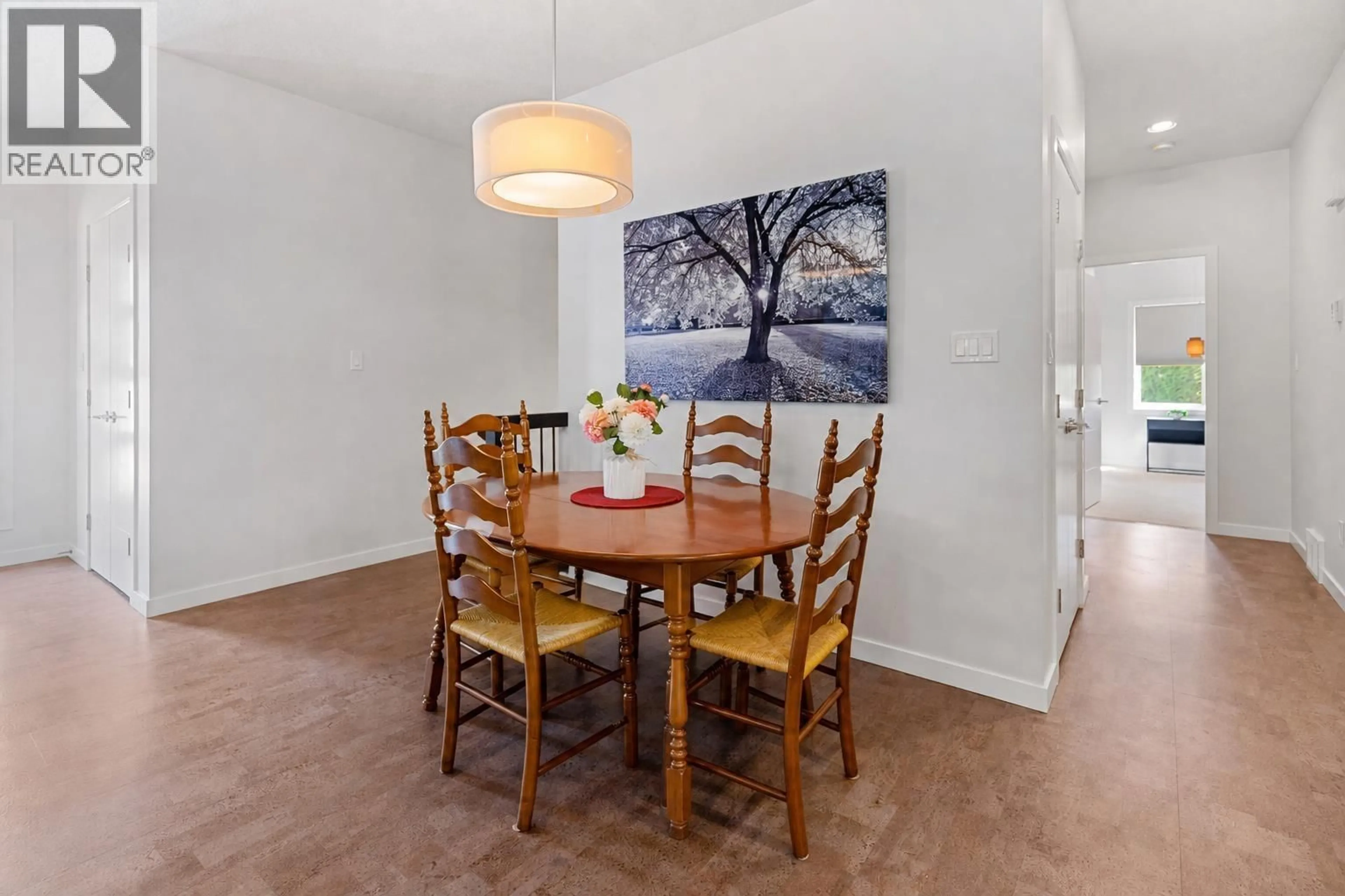 Dining room, wood/laminate floor for 109 - 6525 DOMANO BOULEVARD, Prince George British Columbia V2N0C9