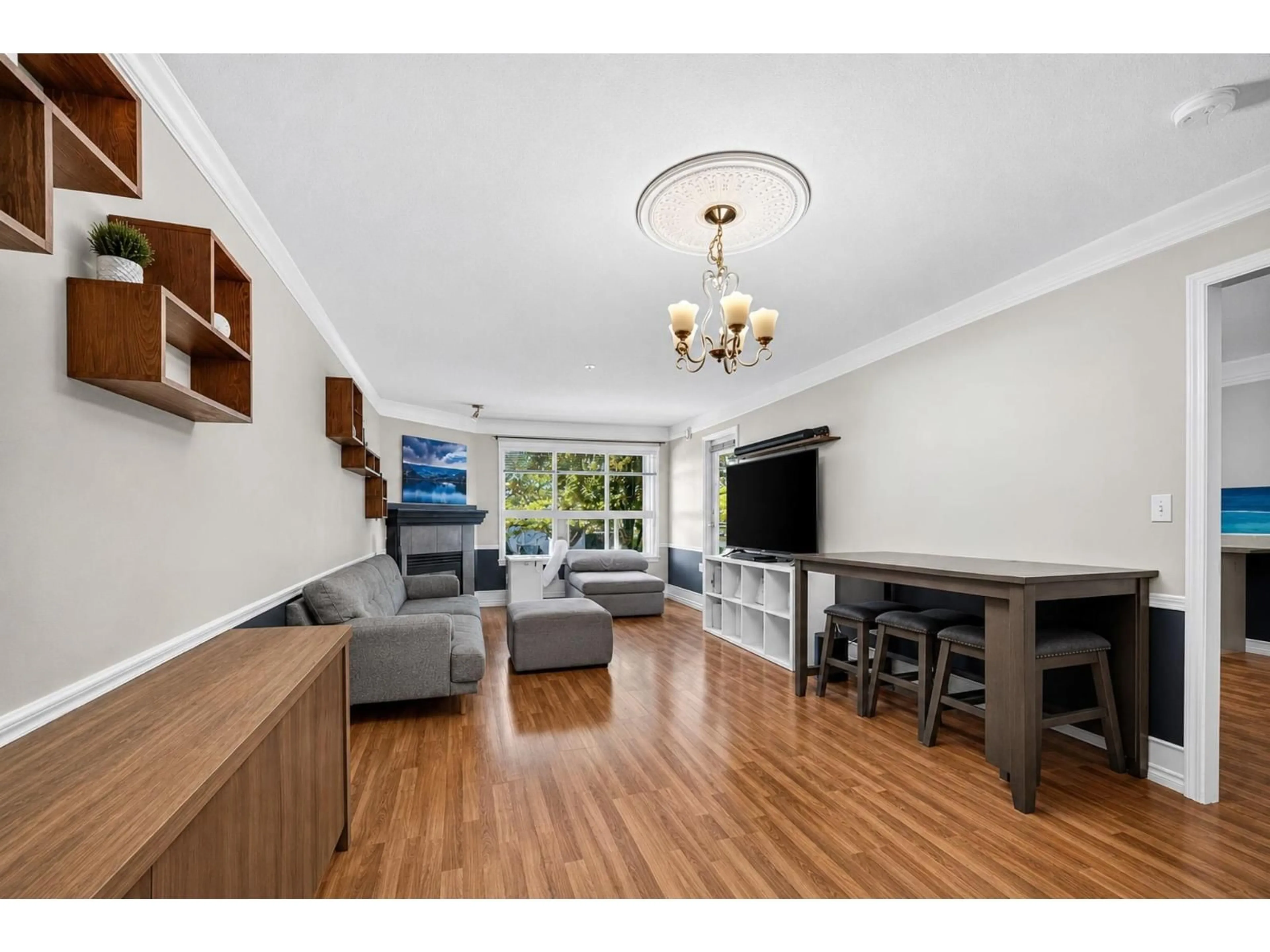 Living room with furniture, wood/laminate floor for 232 - 8068 120A STREET, Surrey British Columbia V3W3P3
