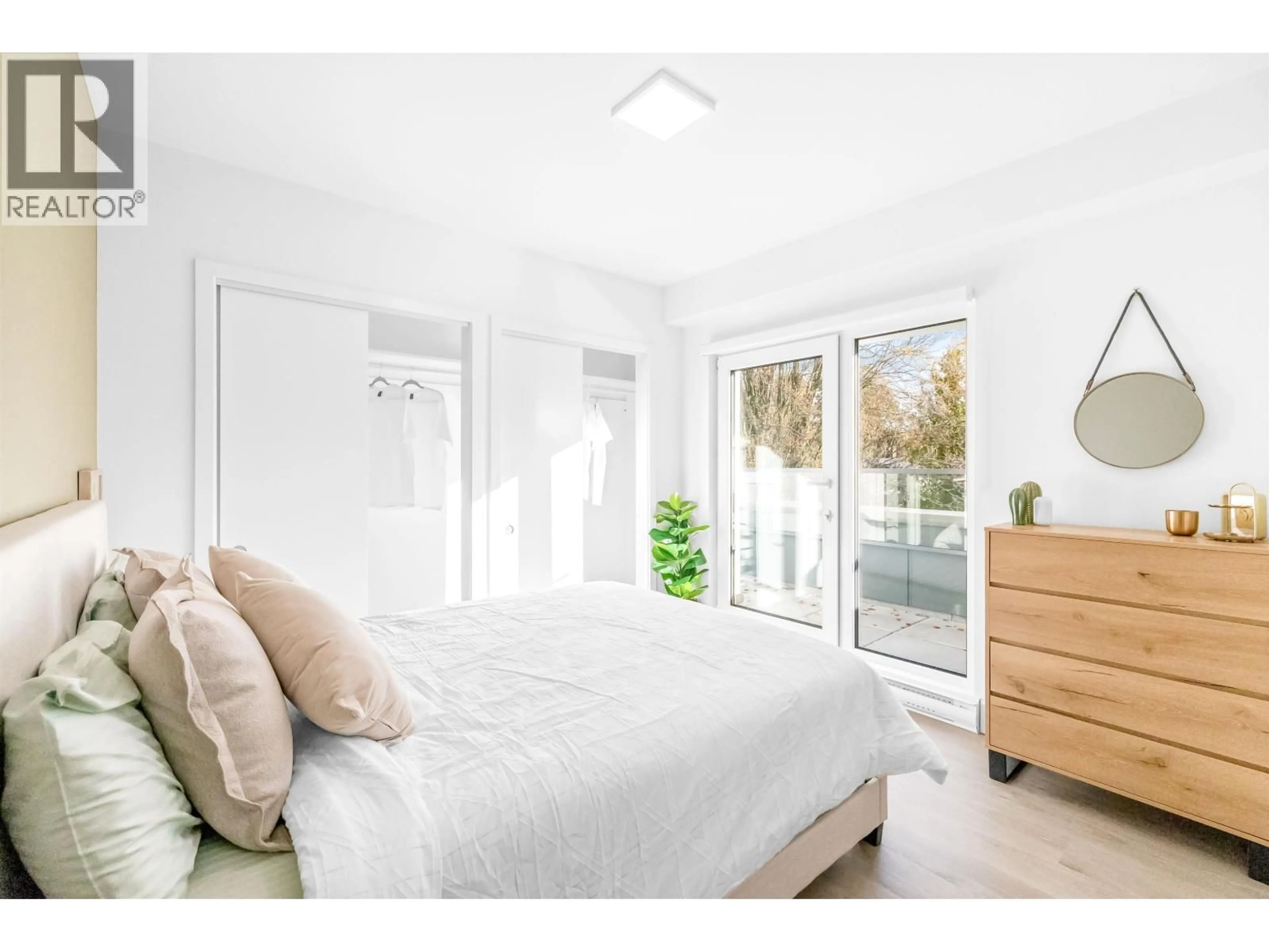 Bedroom with bed, wood/laminate floor for 111 - 2085 1ST AVENUE, Vancouver British Columbia V5N1B6