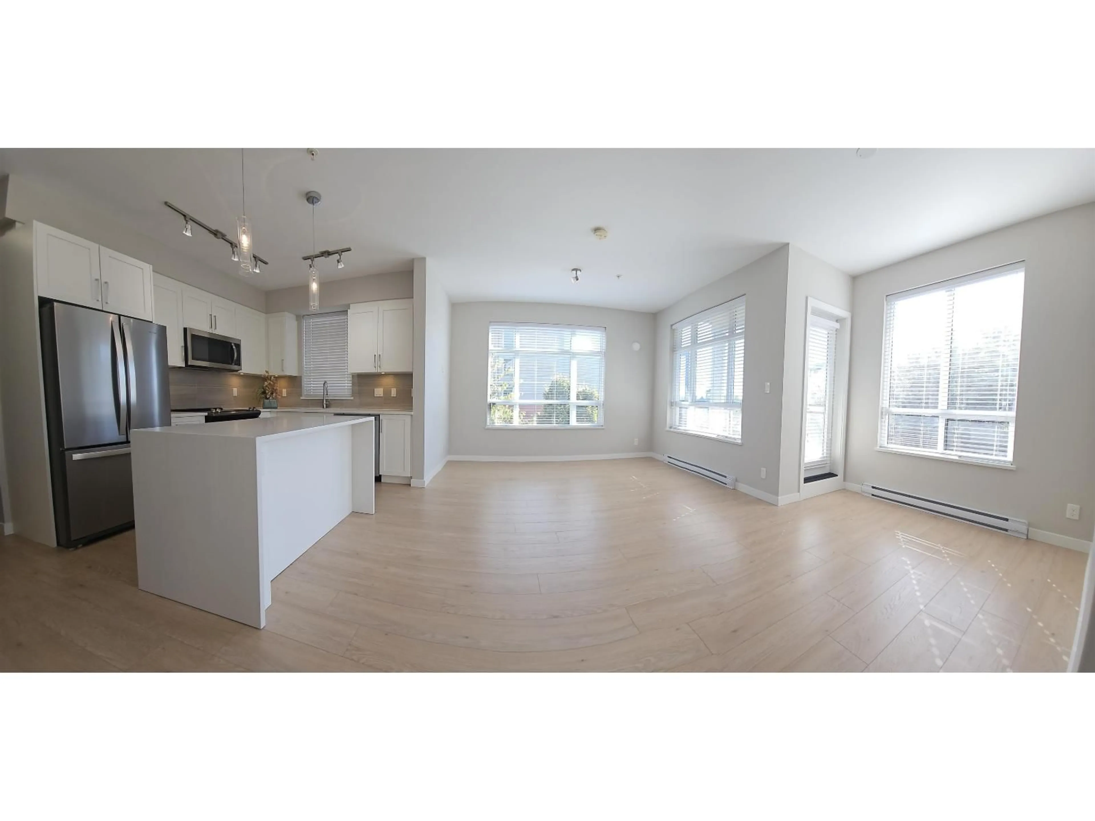 Open concept kitchen, wood/laminate floor for E208 - 20211 66 AVENUE, Langley British Columbia V2Y0L4