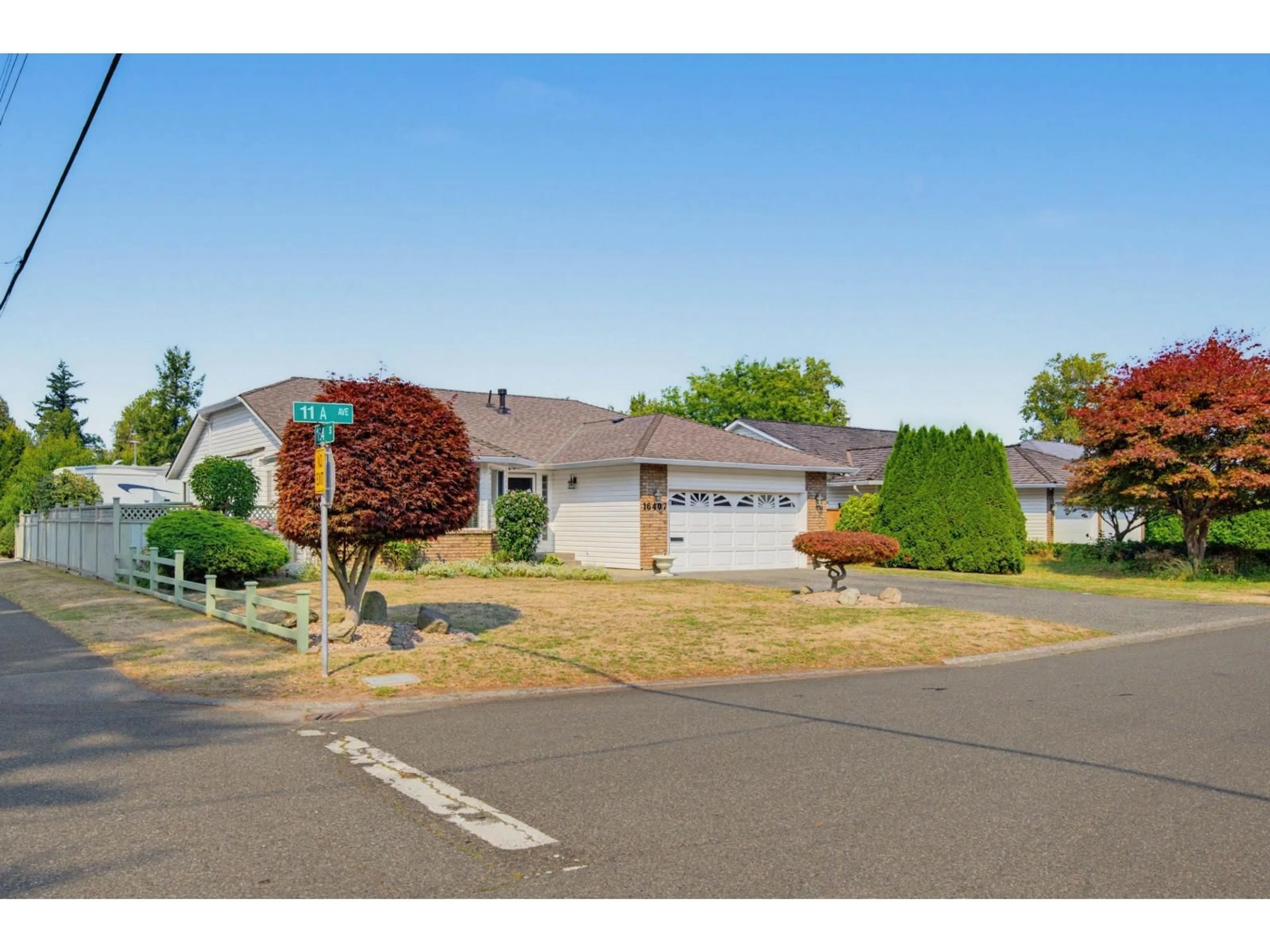 Home with vinyl exterior material, street for 16407 11A AVENUE, Surrey British Columbia V4A9G9