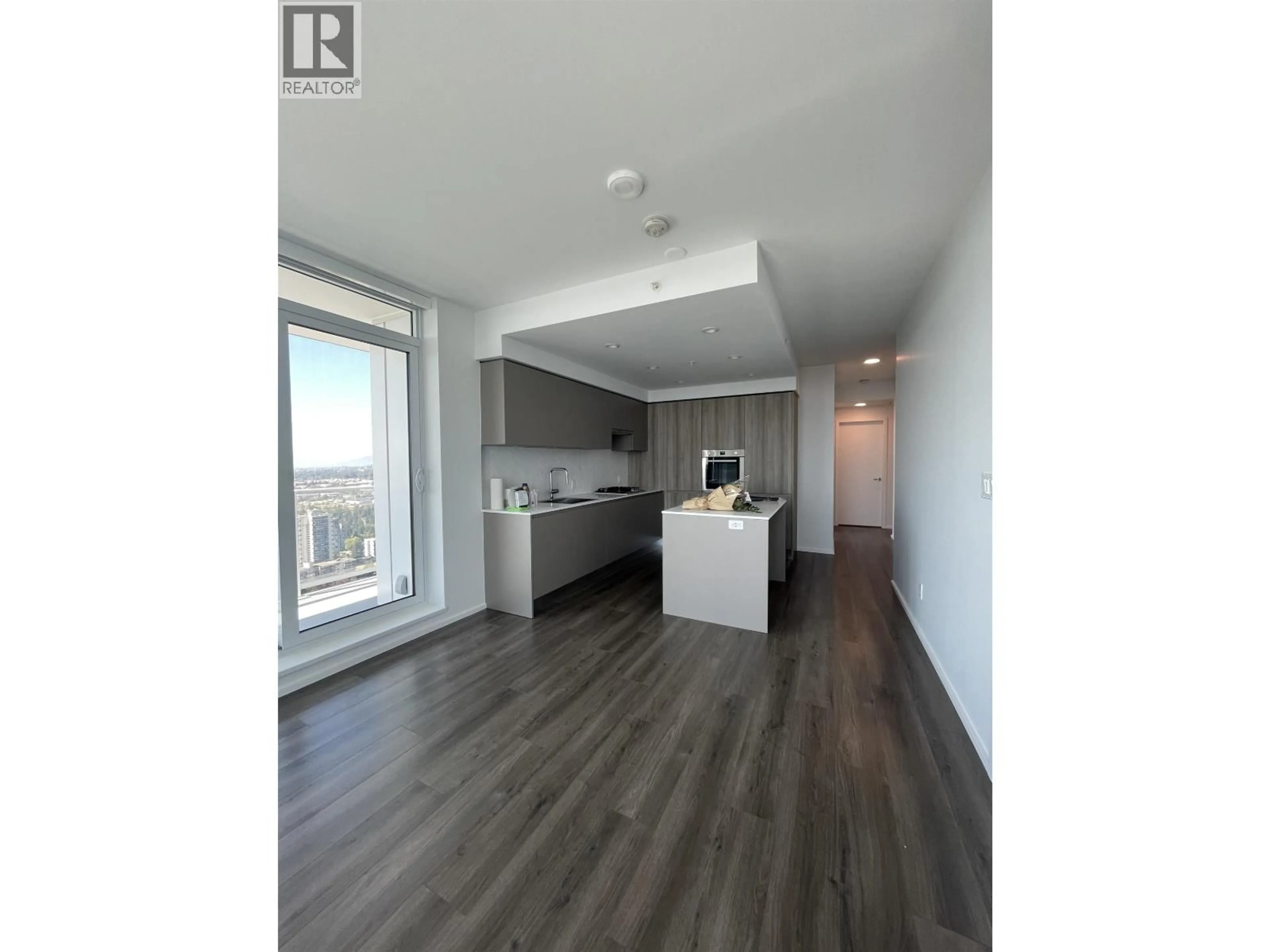 Open concept kitchen, wood/laminate floor for 3907 - 3833 EVERGREEN PLACE, Burnaby British Columbia V3J0M2