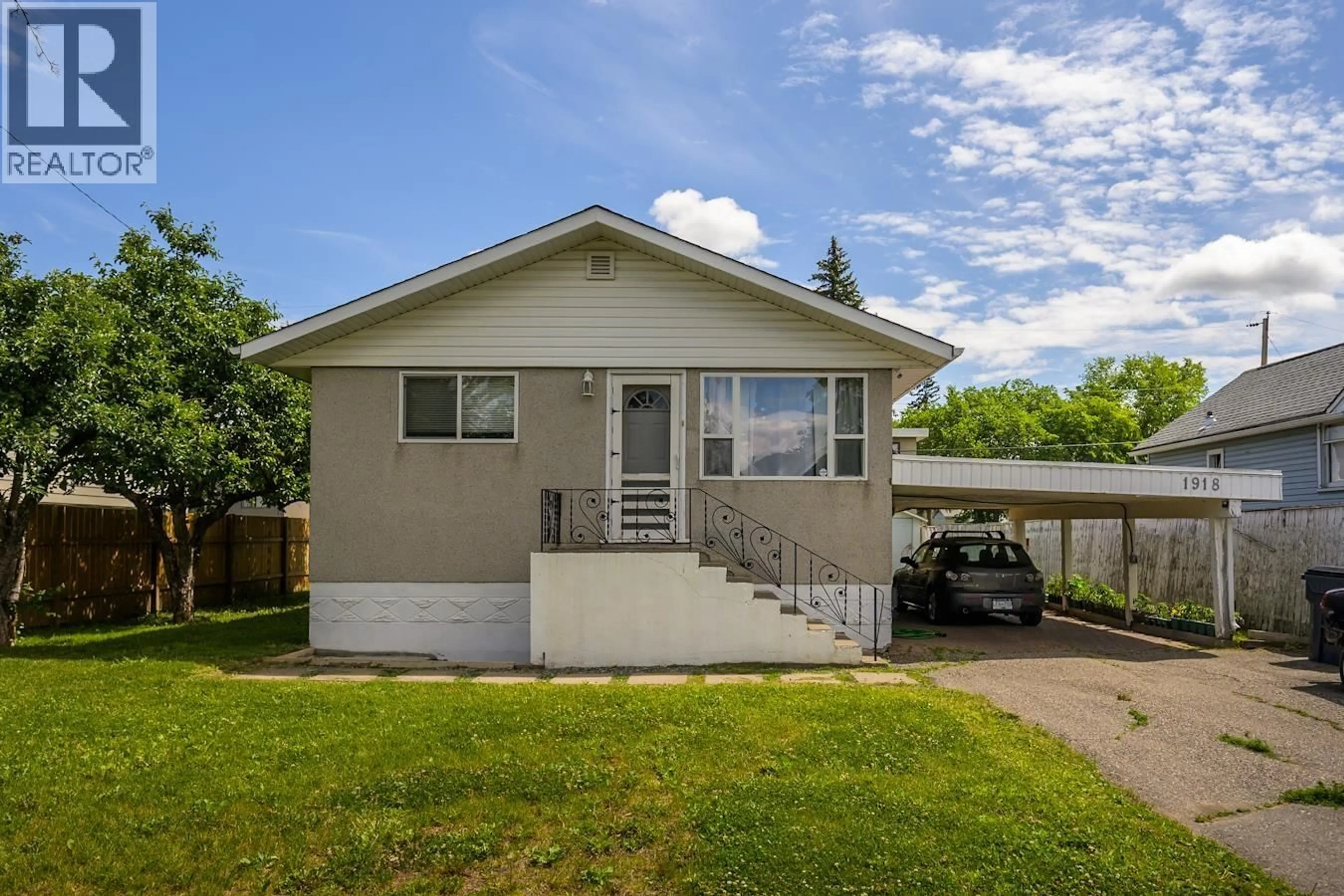 Home with vinyl exterior material, street for 1918 VINE STREET, Prince George British Columbia V2L2W8