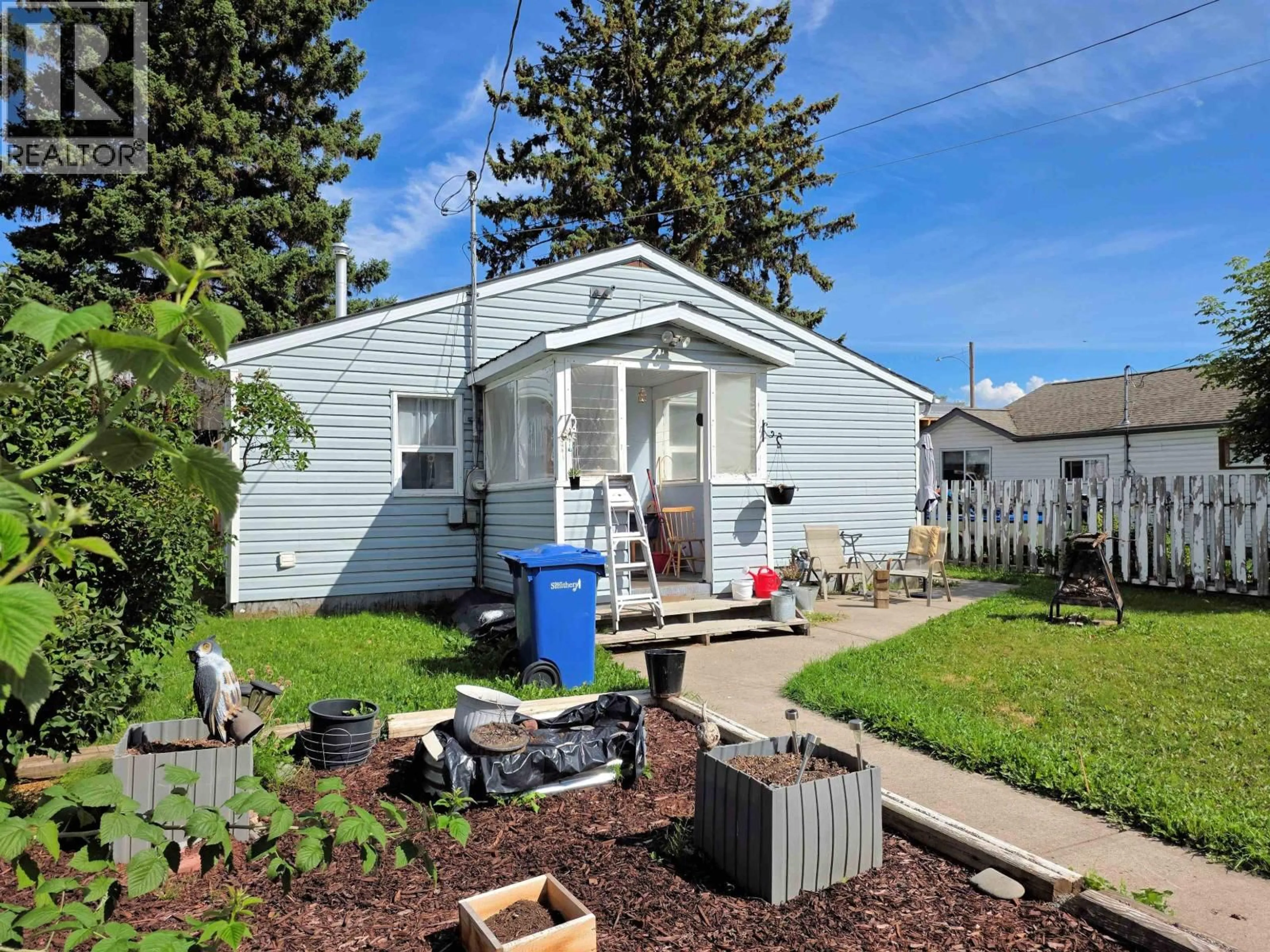 Home with vinyl exterior material, street for 3983 SECOND AVENUE, Smithers British Columbia V0J2N0