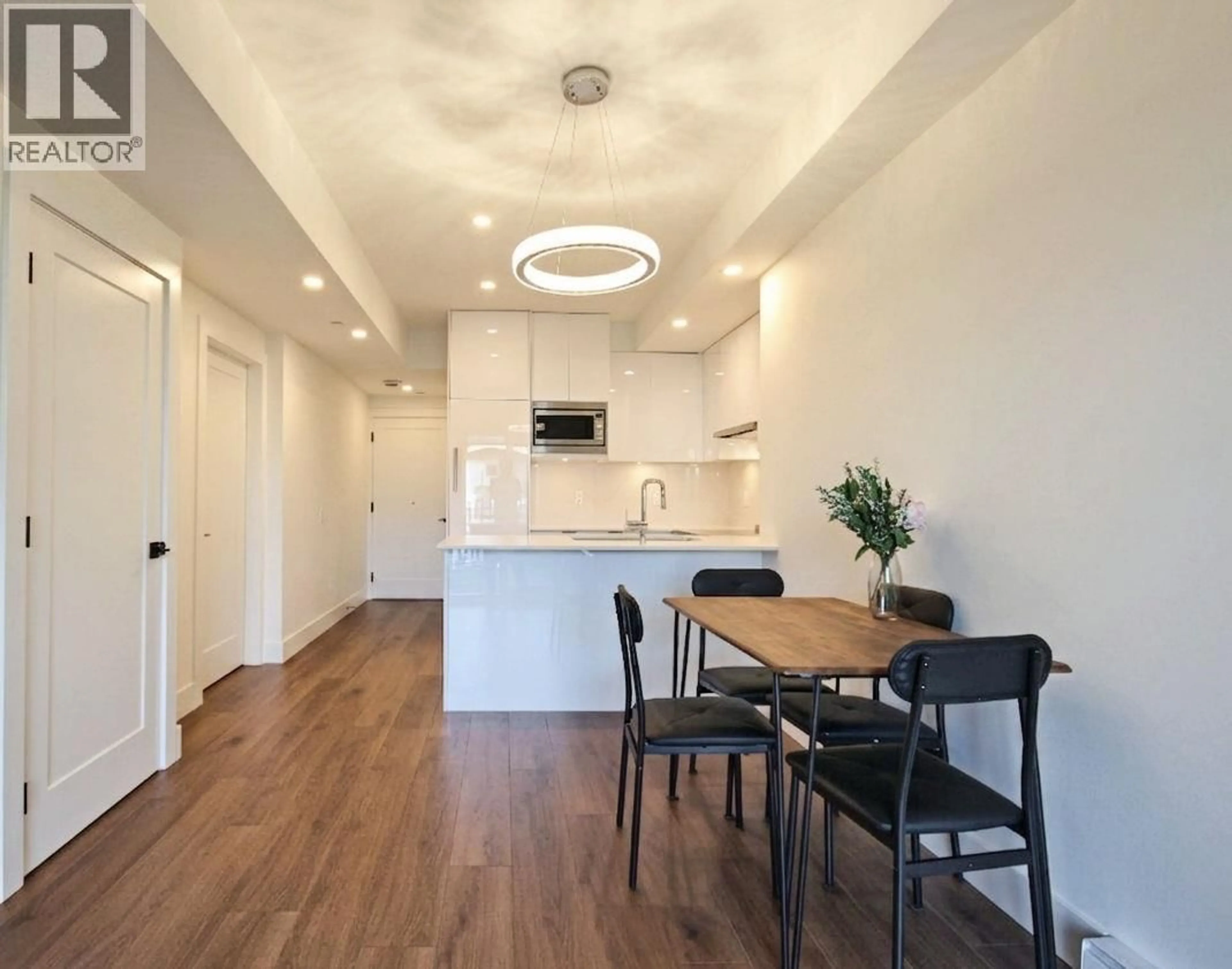 Open concept kitchen, wood/laminate floor for 105 - 5399 JOYCE STREET, Vancouver British Columbia V5R4H3