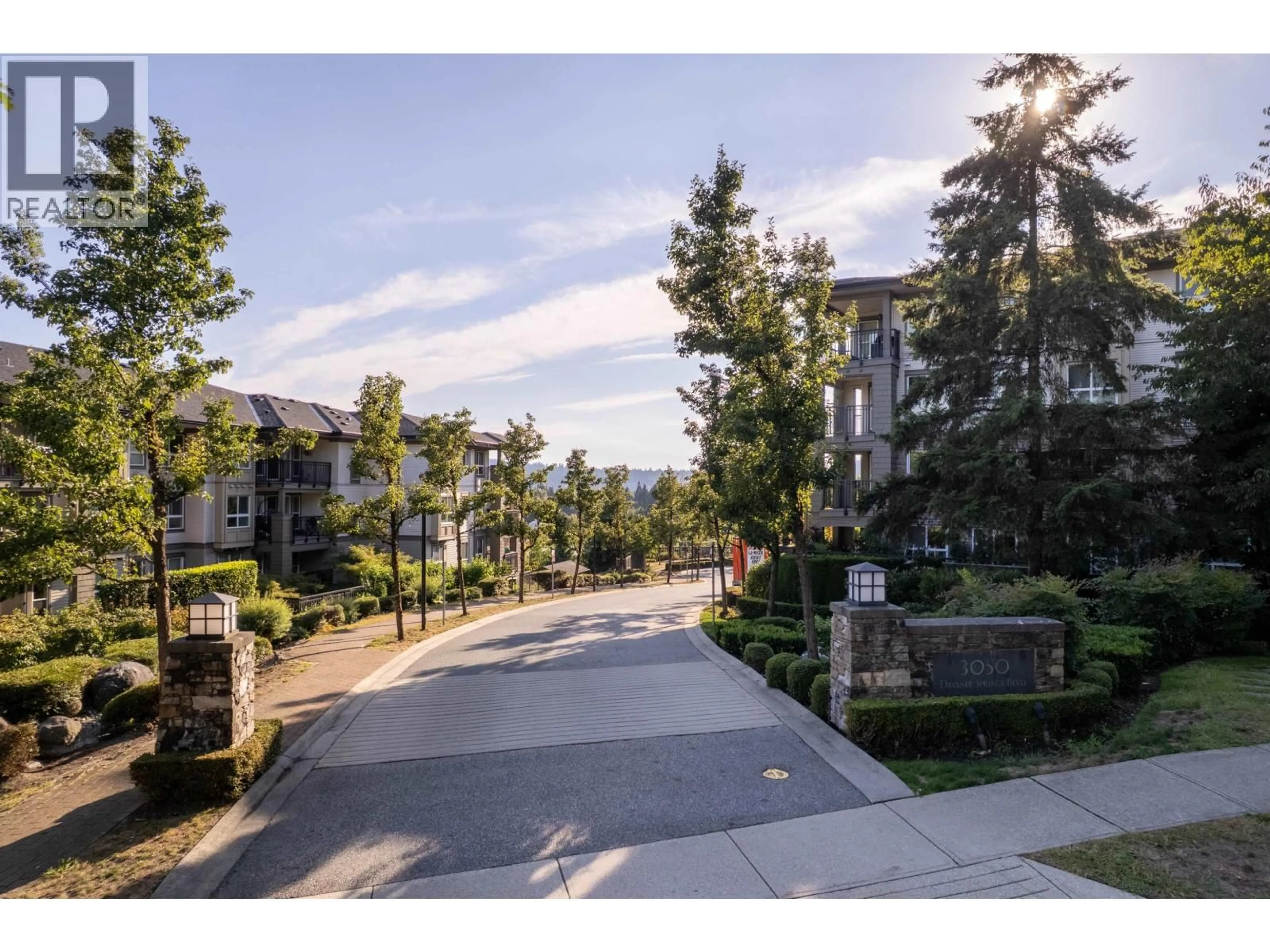 A pic from outside/outdoor area/front of a property/back of a property/a pic from drone, mountain view for 105 - 3050 DAYANEE SPRINGS BOULEVARD, Coquitlam British Columbia V3E0A2