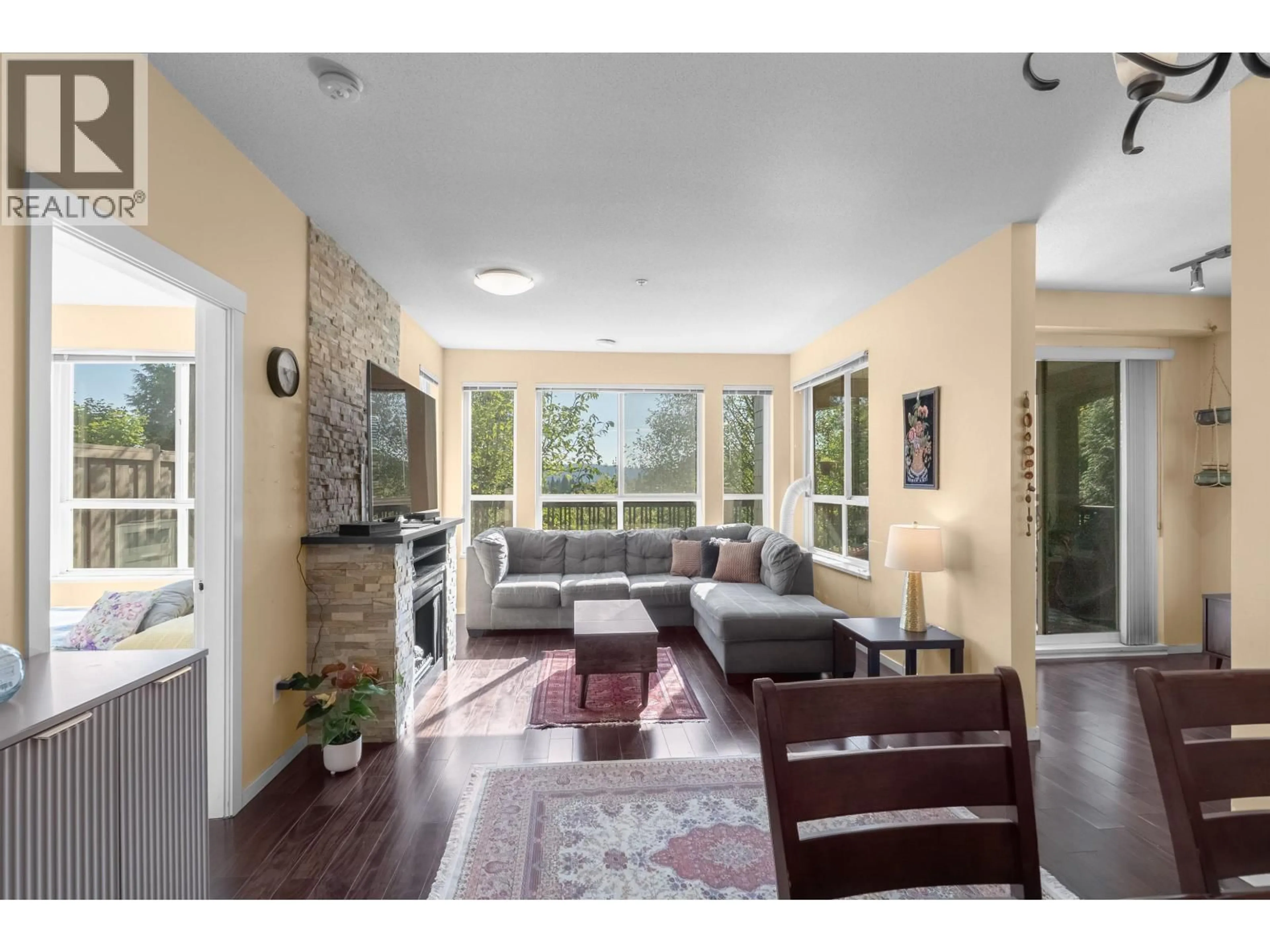 Living room with furniture, unknown for 105 - 3050 DAYANEE SPRINGS BOULEVARD, Coquitlam British Columbia V3E0A2