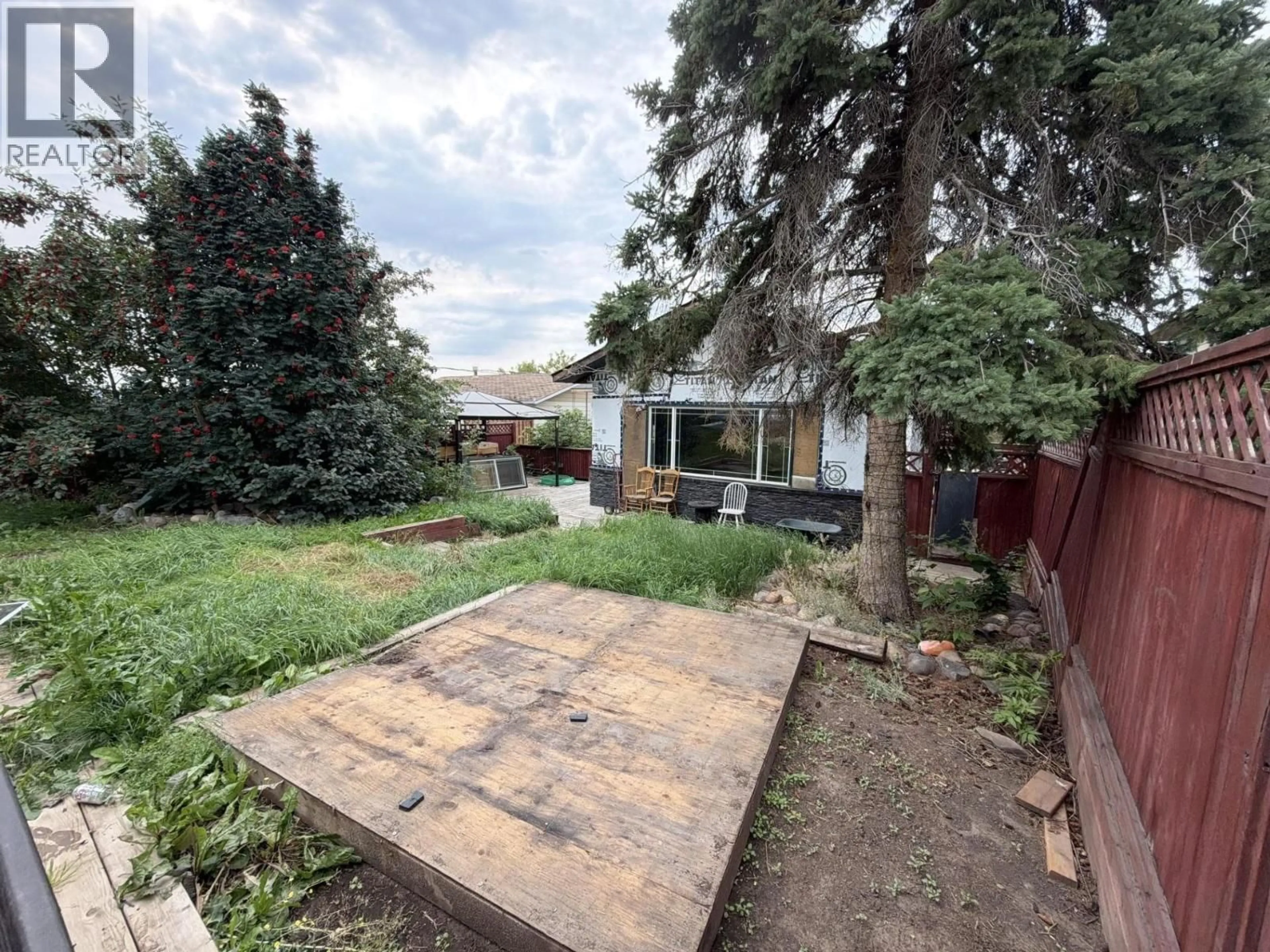 A pic from outside/outdoor area/front of a property/back of a property/a pic from drone, street for 9019 88 STREET, Fort St. John British Columbia V1J5B1