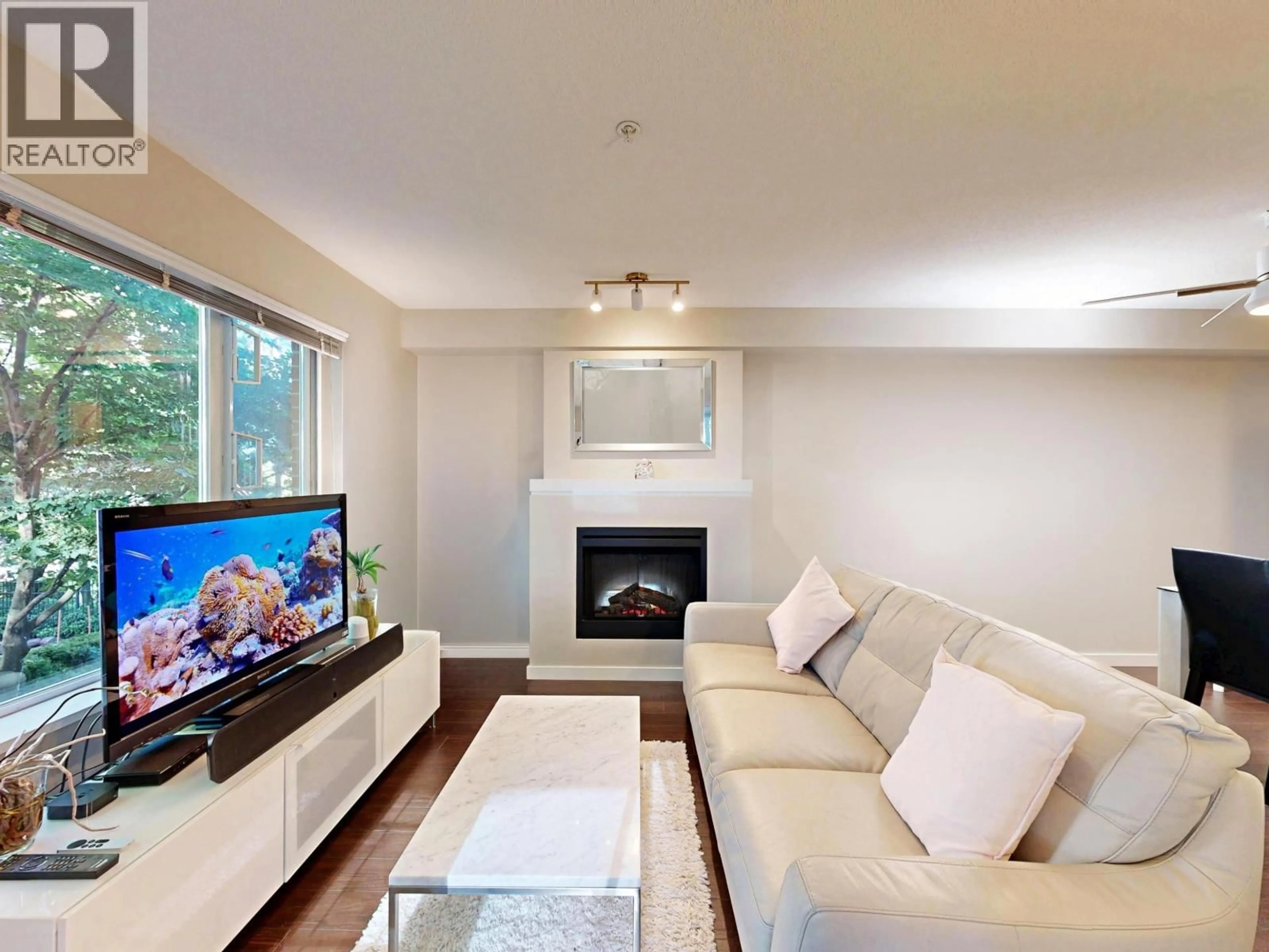 Living room with furniture, wood/laminate floor for 207 - 4783 DAWSON STREET, Burnaby British Columbia V5C0A8
