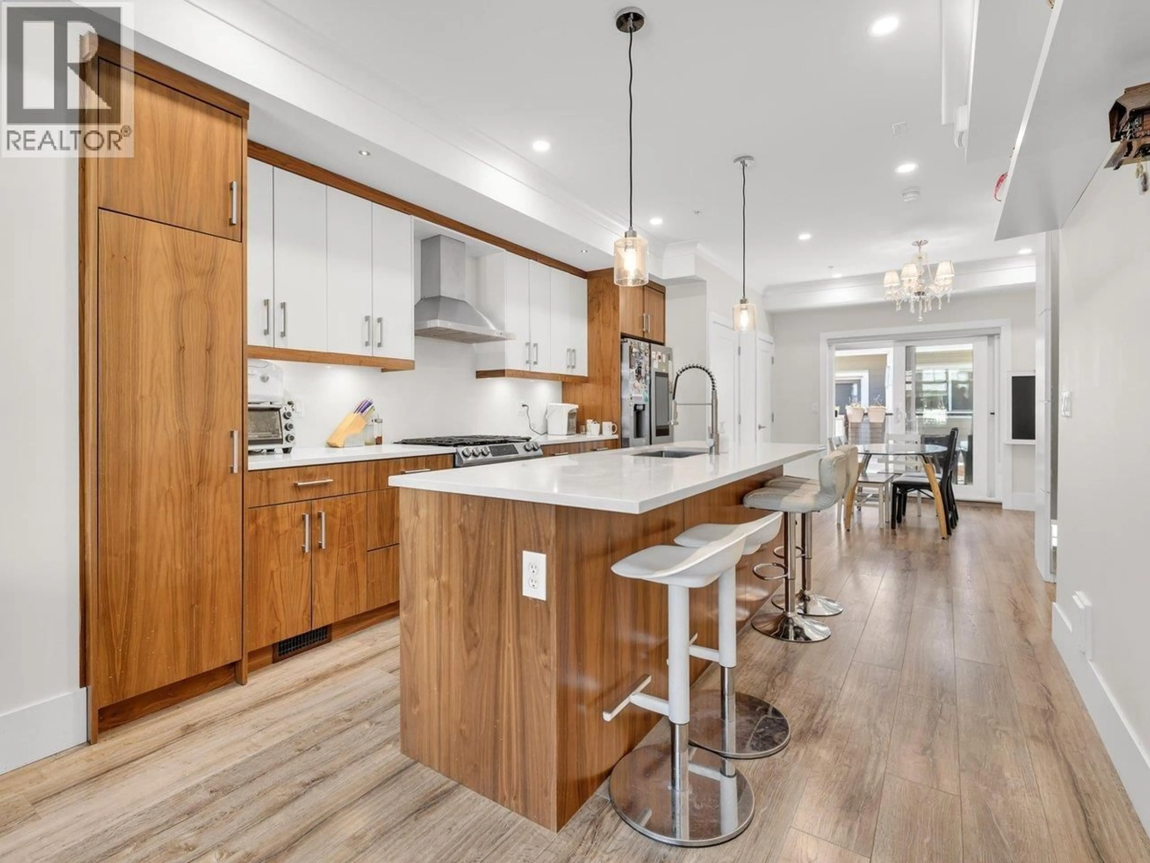 Open concept kitchen, wood/laminate floor for 4916 ELLIS LANE, Delta British Columbia V4K0E1