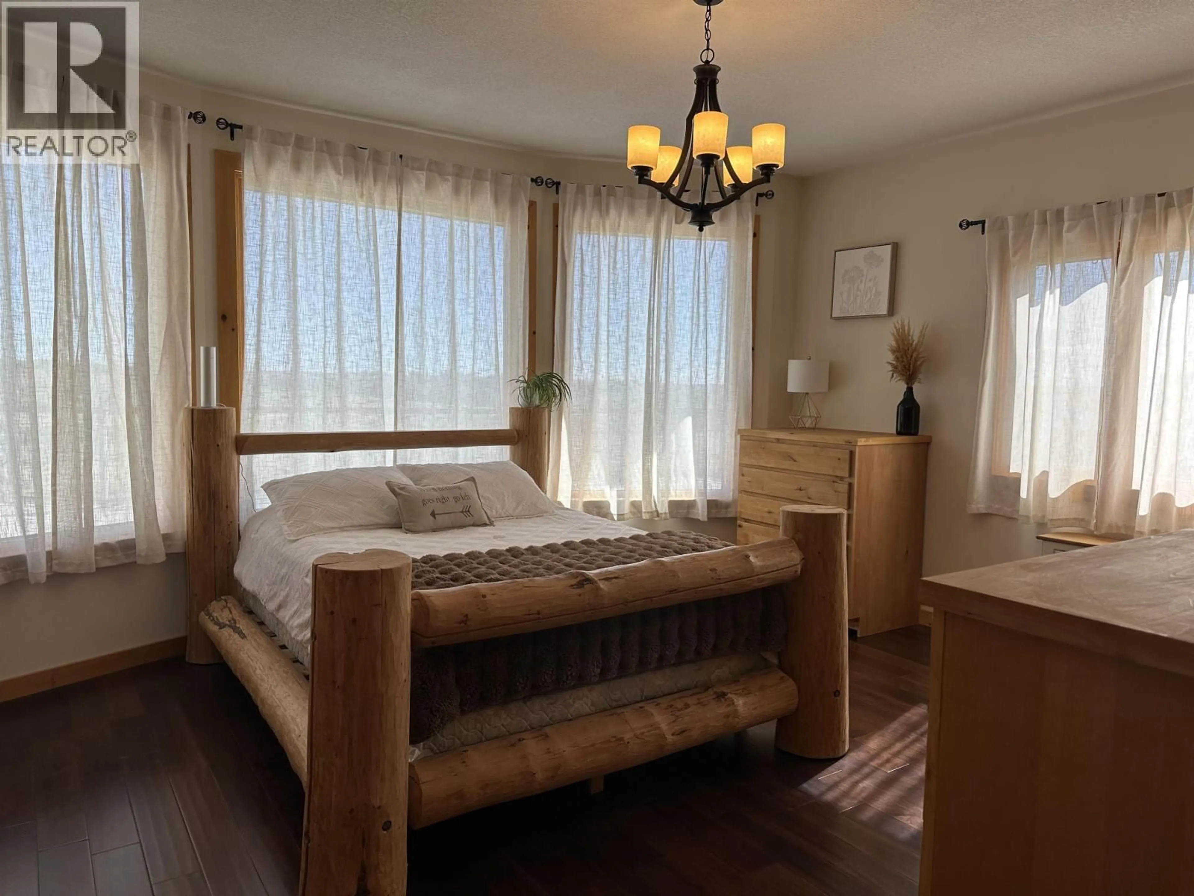 Bedroom with bed, wood/laminate floor for 16767 277 ROAD, Fort St. John British Columbia V0C1Y0