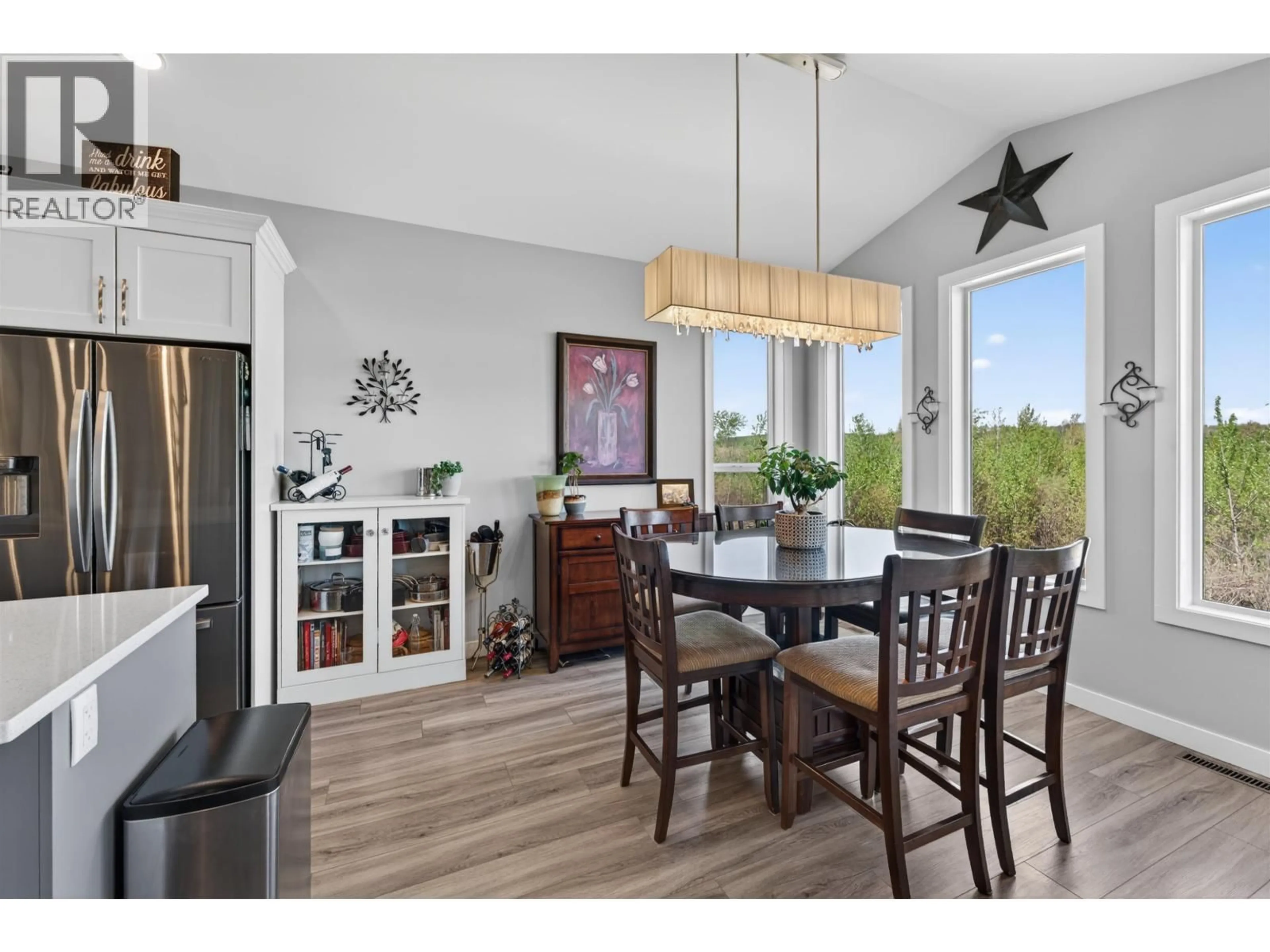 Open concept kitchen, wood/laminate floor for 10612 114A AVENUE, Fort St. John British Columbia V1J0S1