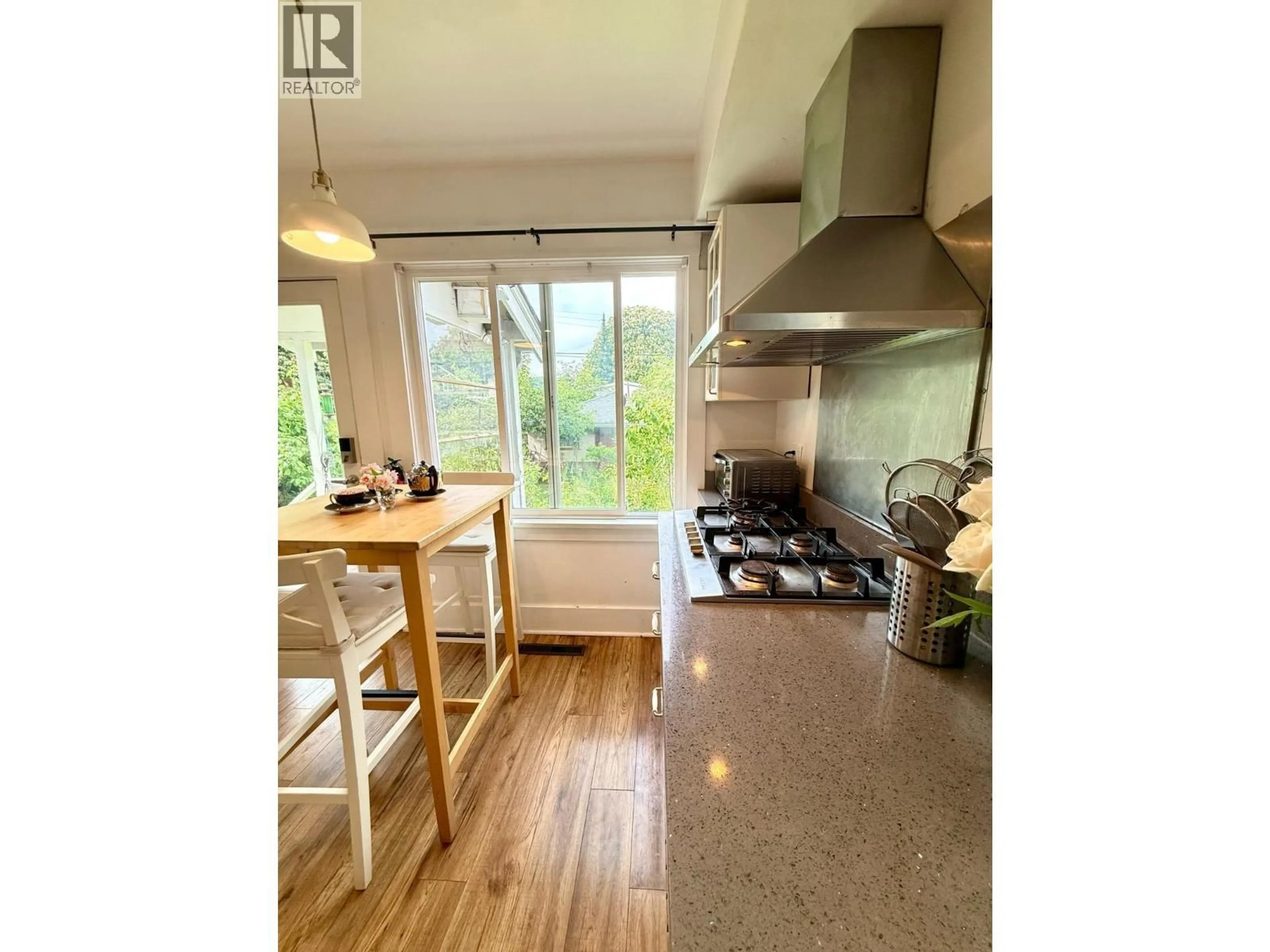 Open concept kitchen, wood/laminate floor for 2791 13TH AVENUE, Vancouver British Columbia V6K2T5