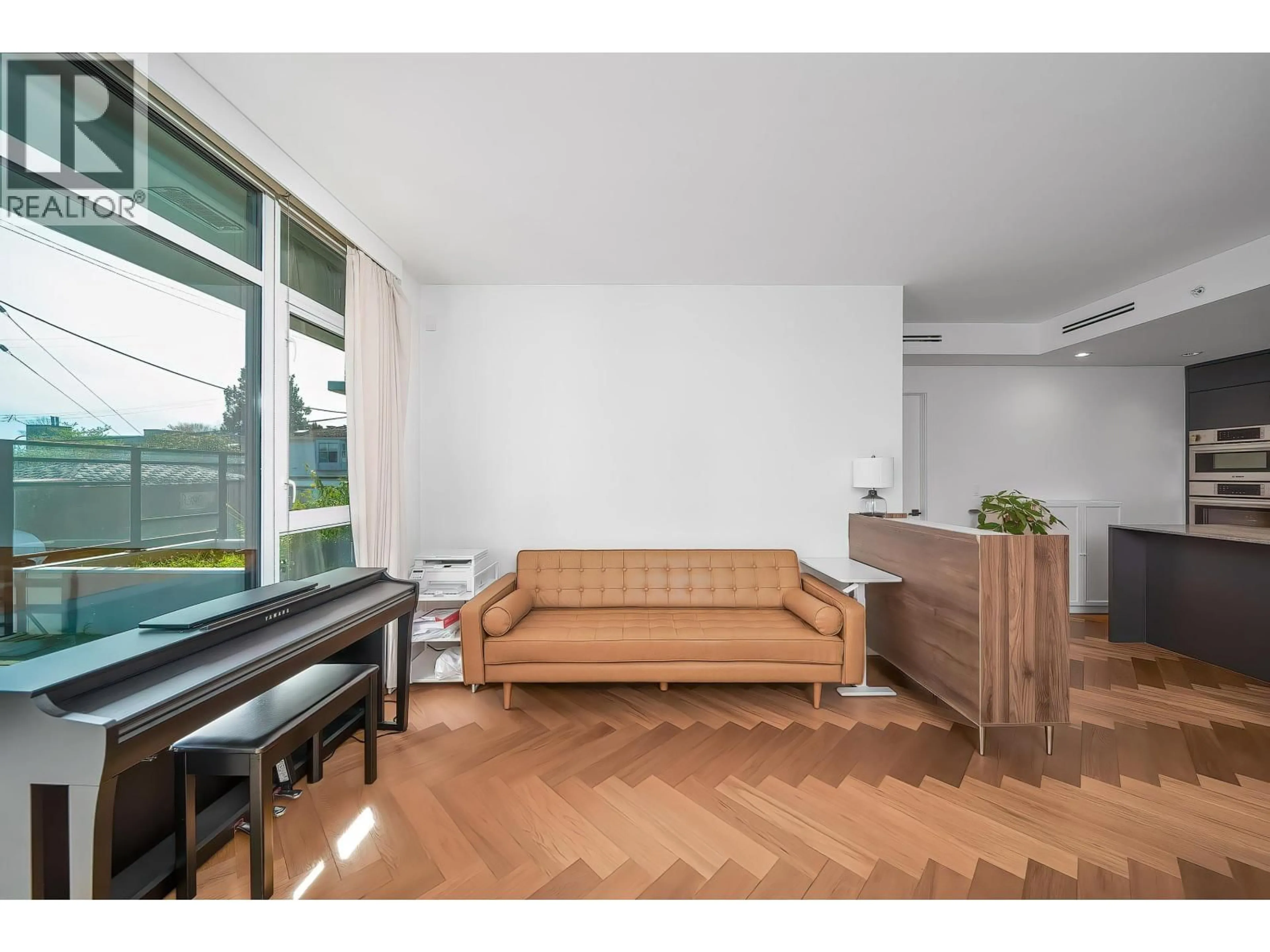 Living room with furniture, wood/laminate floor for 106 - 458 63RD AVENUE, Vancouver British Columbia V5X2J4