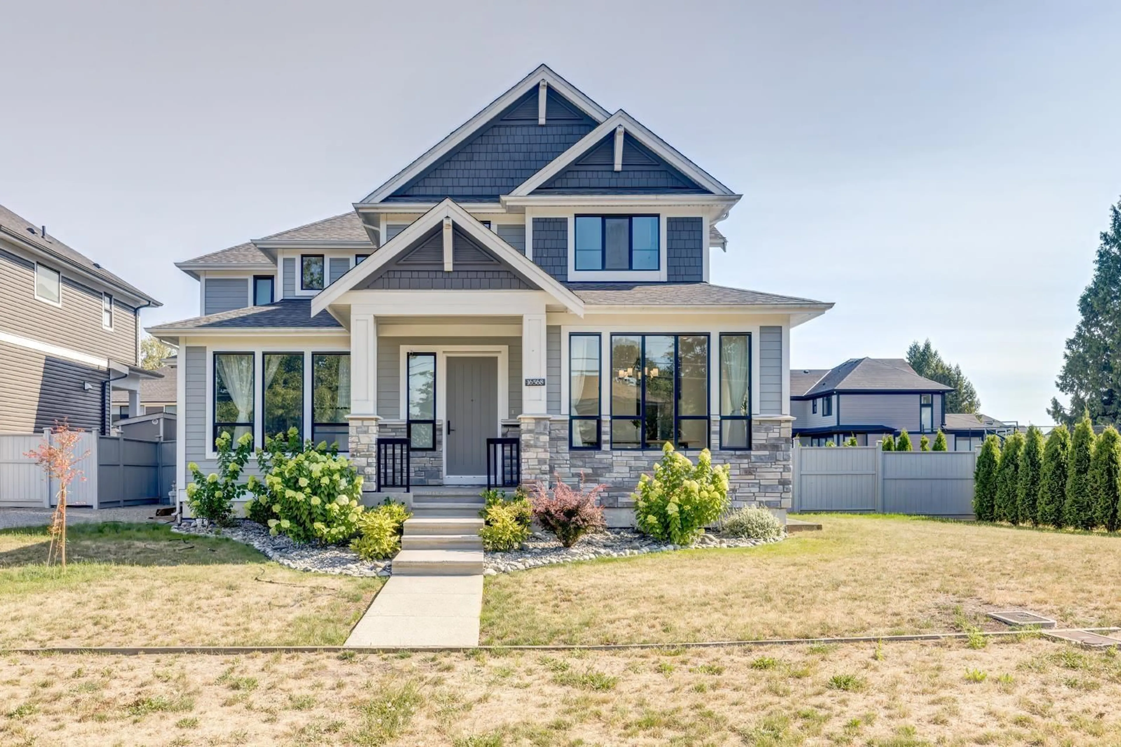 Home with vinyl exterior material, street for 16568 104 AVENUE, Surrey British Columbia V4N6V4