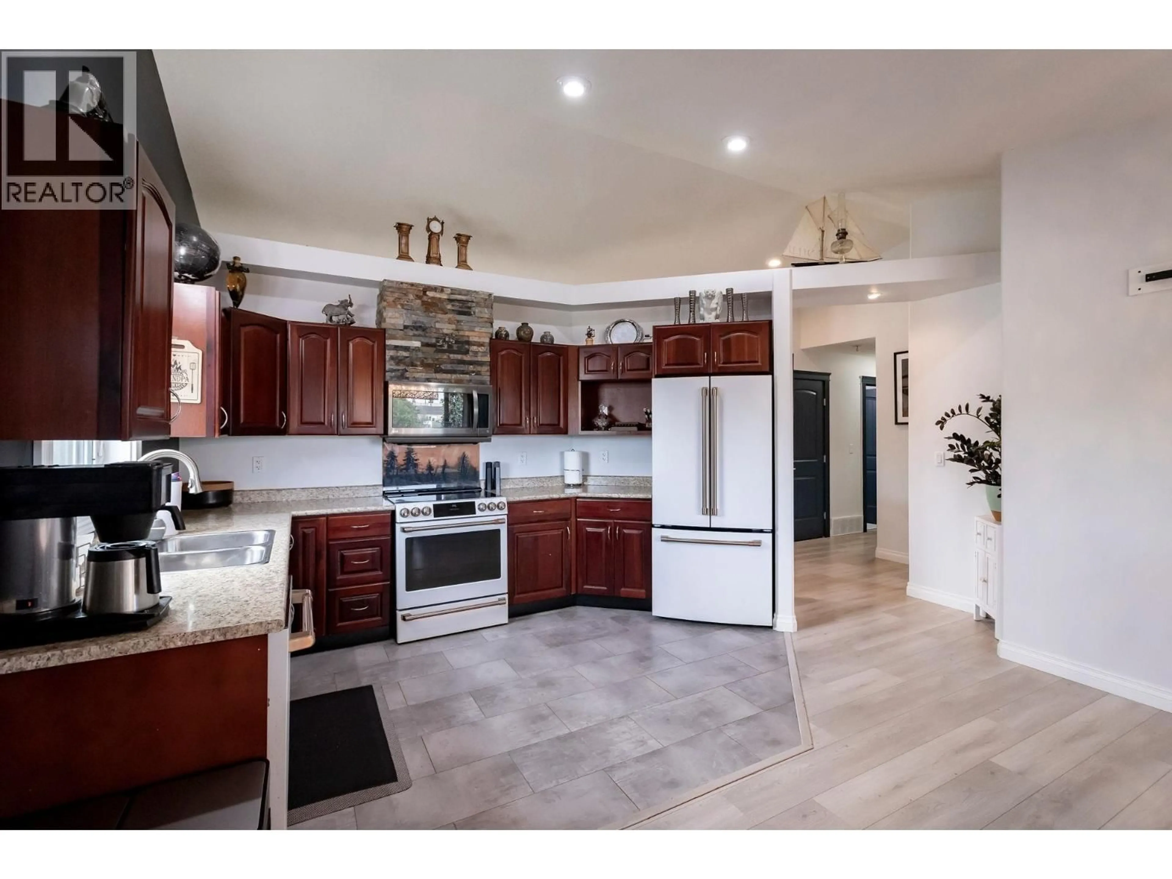 Open concept kitchen, ceramic/tile floor for 9720 118 AVENUE, Fort St. John British Columbia V1J0E9