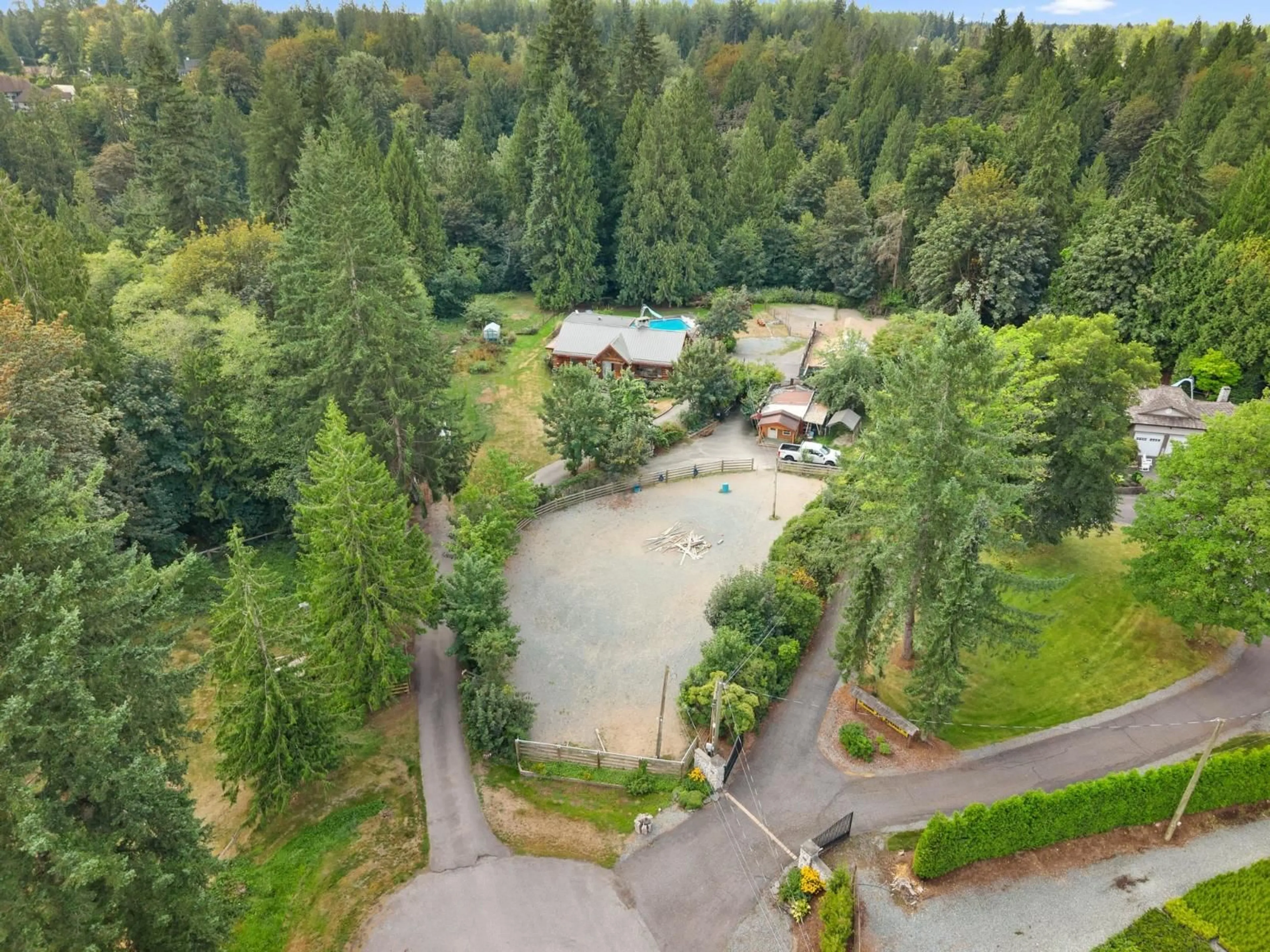 A pic from outside/outdoor area/front of a property/back of a property/a pic from drone, forest/trees view for 7275 253 STREET, Langley British Columbia V4W1V1
