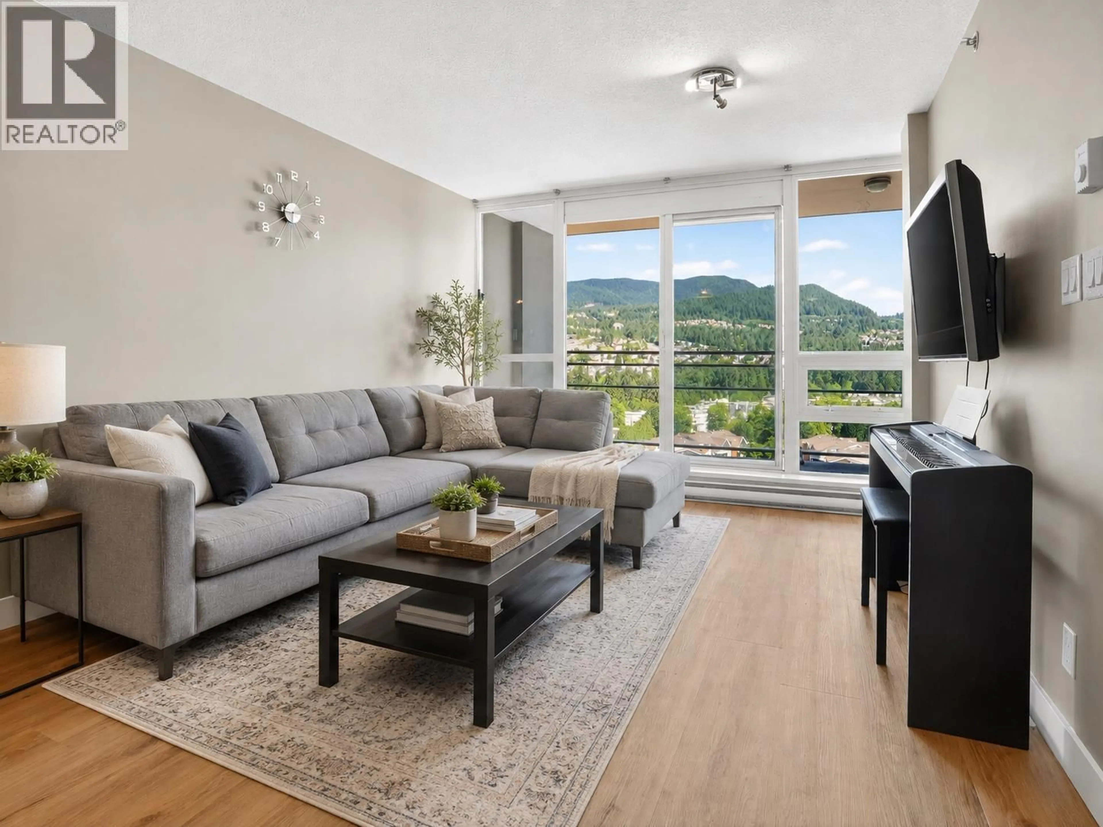 Living room with furniture, wood/laminate floor for 2102 - 2978 GLEN DRIVE, Coquitlam British Columbia V3B0C3