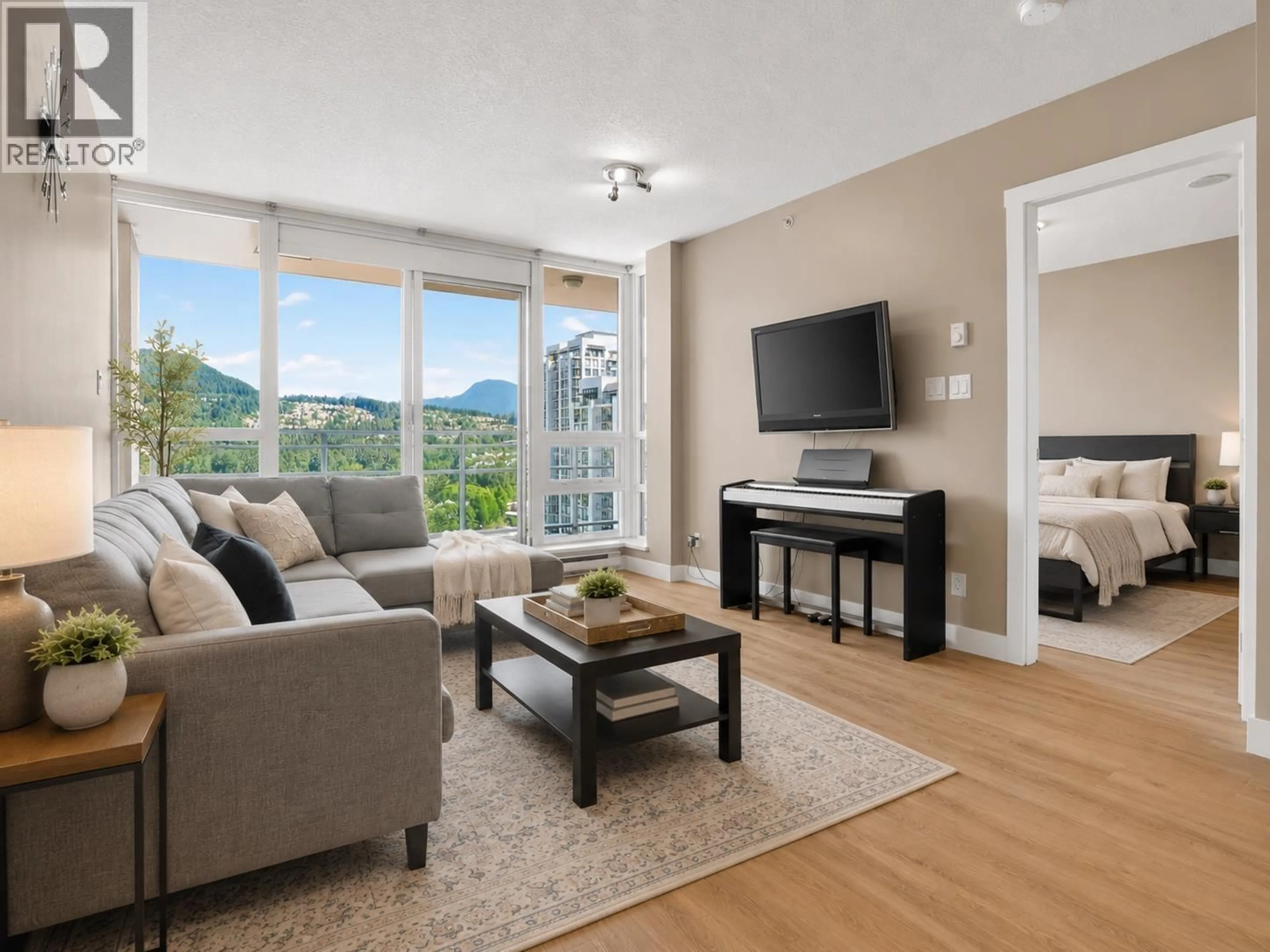 Living room with furniture, wood/laminate floor for 2102 - 2978 GLEN DRIVE, Coquitlam British Columbia V3B0C3